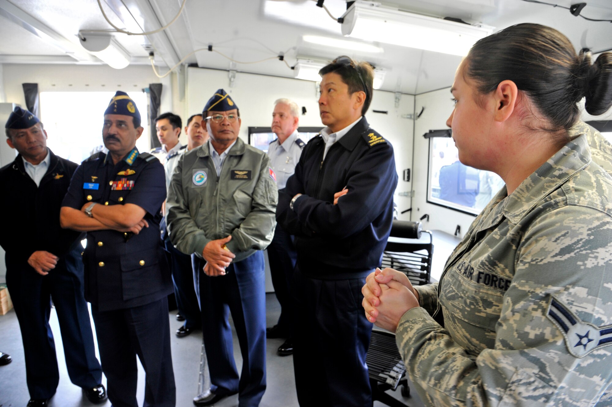 Airman 1st Class Shelby K. Parry, 818th Global Mobility Readiness Squadron communications technician, explains deployable 621st Contingency Response Wing communications equipment to Air Chiefs from countries in the Pacific region during a visit to Joint Base McGuire-Dix-Lakehurst, N.J. Oct. 26.  The Air Chiefs toured several Air Force bases during their weeklong trip to the U.S.  During their stop at JB MDL, the Air Chief's also witnessed convoy training procedures by the U.S. Air Force Expeditionary Center, C-17 capabilities demonstration by the 305th Air Mobility Wing and an aeromedical evacuation presentation by the 514th Air Mobility Wing.  (U.S. Air Force photo by Master Sgt. Laura K. Deckman)(released)