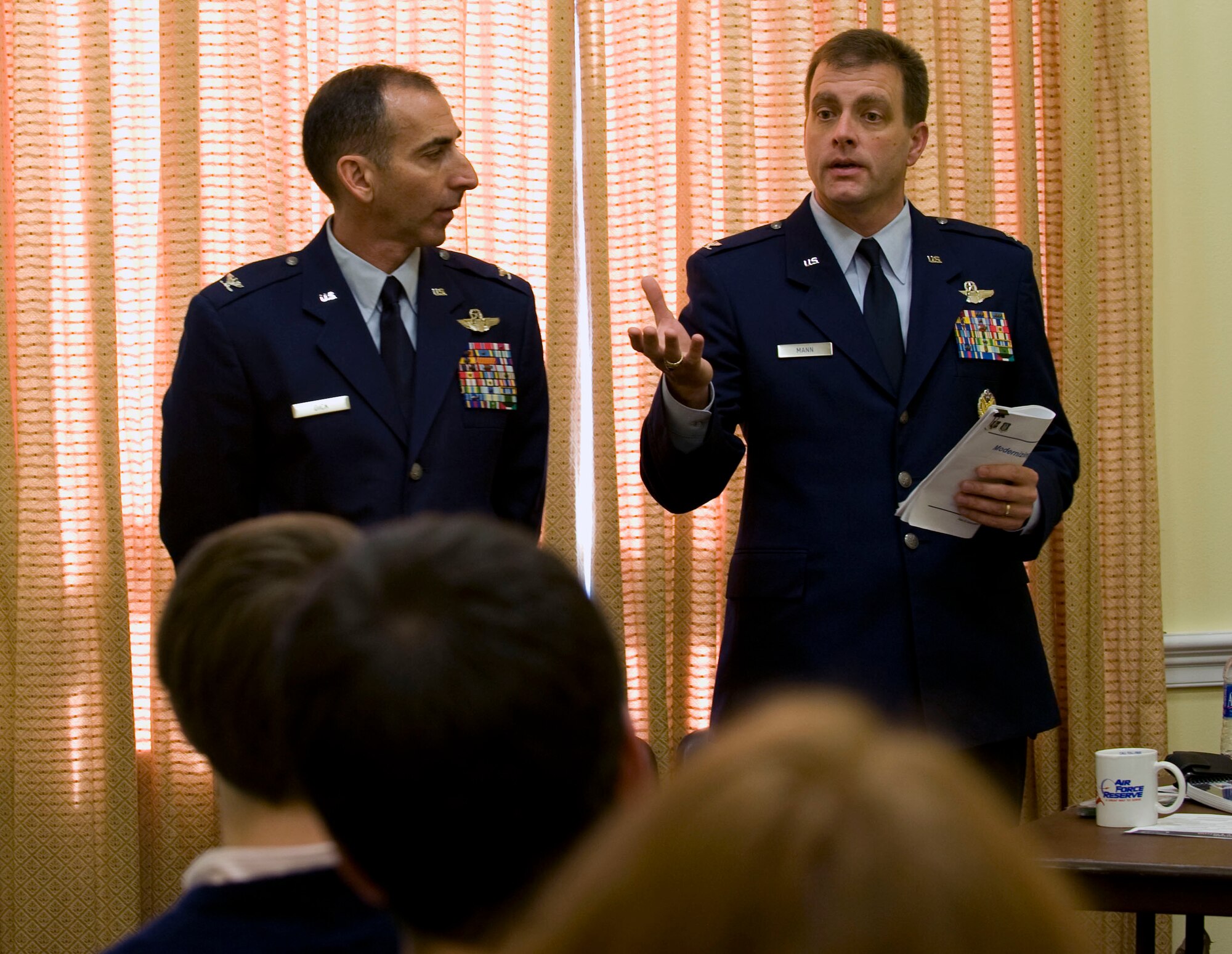 Colonel Leonard Dick, (on left) vice commander, Air National Guard Air Force Reserve Command Test Center, Tucson, Ariz., and Col. Eric Mann, Air National Guard director of requirements, address congressional staffers on Capitol Hill on Oct. 28.  The colonels discussed equipment modernization and the special funding program which Congress specifically provides to the Reserve Component.  The Reserve representatives were hosted by the House National Guard and Reserve Component Caucus and provided an update on cost-effective combat equipment acquisitions that are directly effecting military operations at home and abroad.  (U.S. Air Force photo/Staff Sgt. Tiffany Trojca)