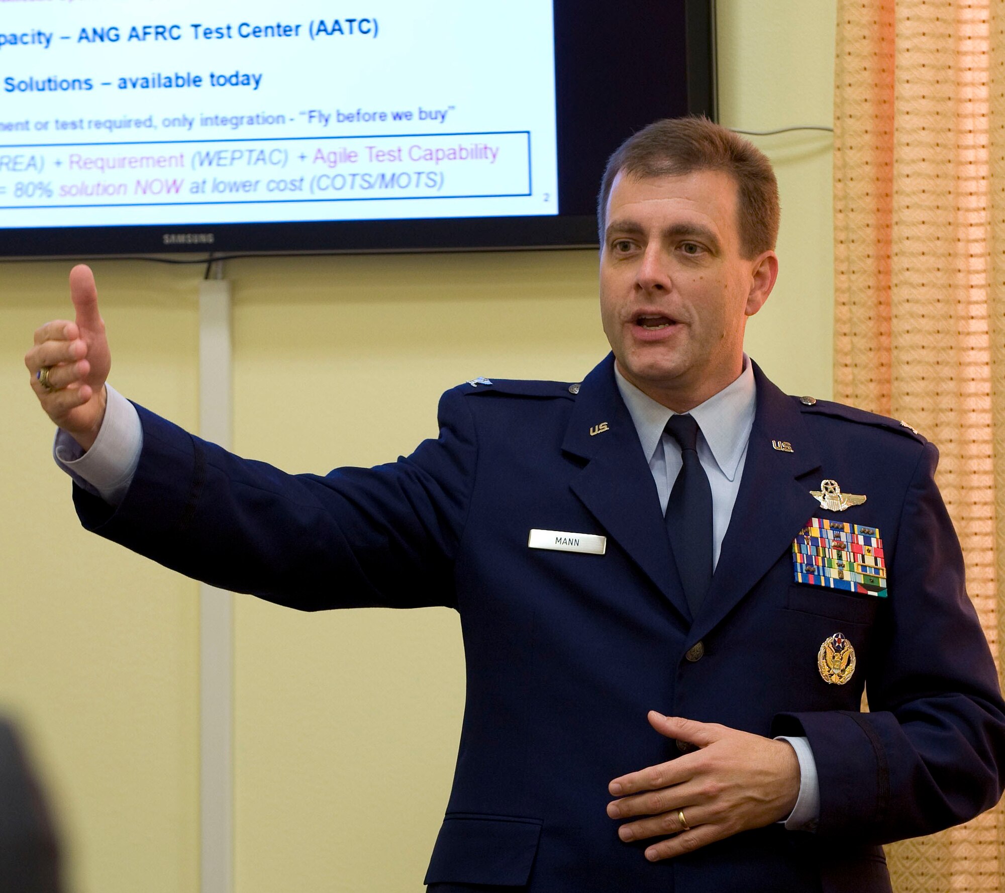 Showing how off-the-shelf technology has resulted in crucial combat capability, Col. Eric Mann, Air National Guard director of requirements, addresses congressional staffers on Capitol Hill on Oct. 28.  According to Mann, the Air Force Reserve and Air Guard are modernized in an extremely cost-effective and efficient process using National Guard and Reserve Equipment Appropriations funding provided by Congress.  This special funding results in a very streamlined process that saves lives, increases combat capability, and speeds high-tech acquisitions. (U.S. Air Force photo/Staff Sgt. Tiffany Trojca)