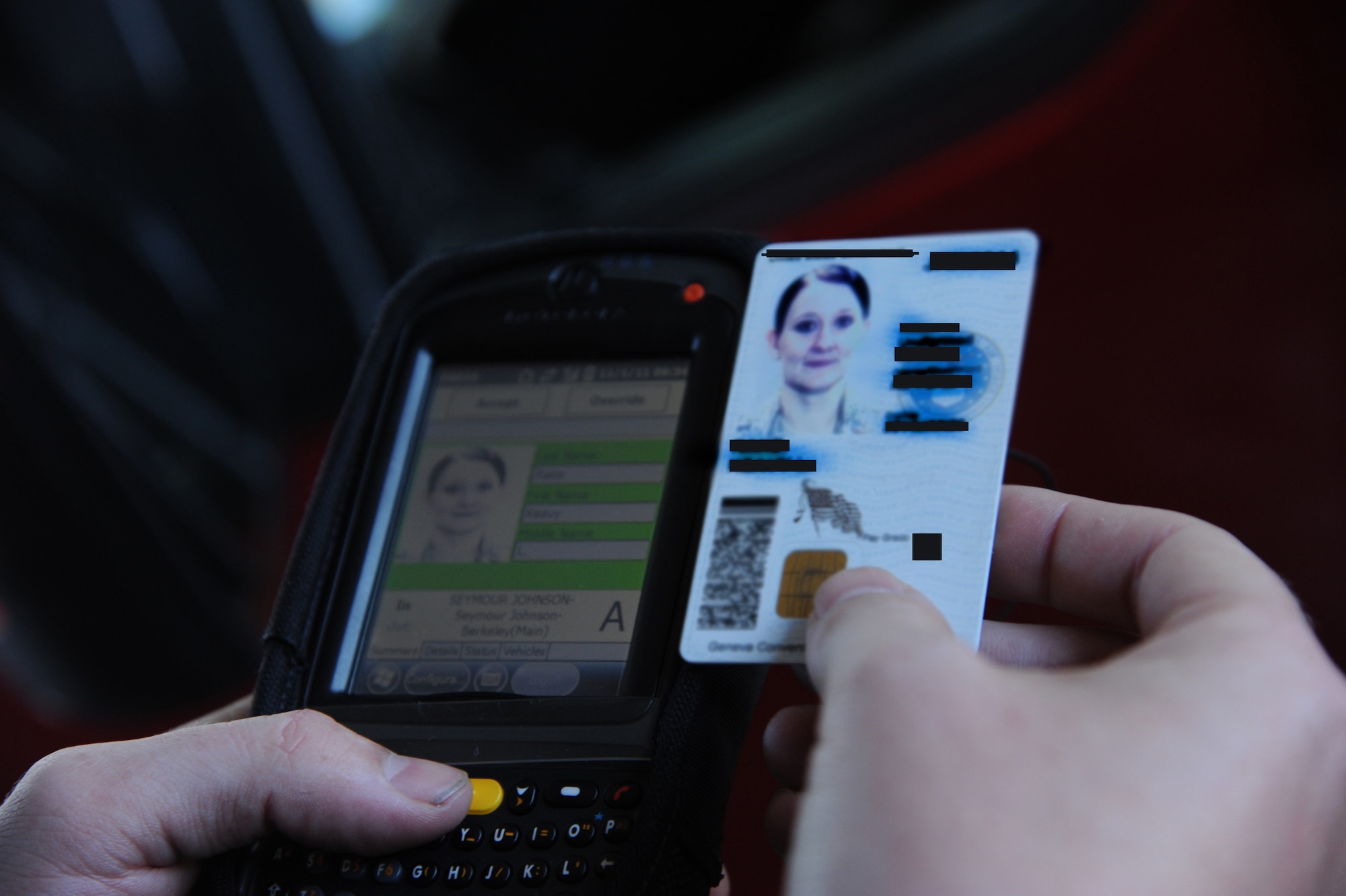 Airman 1st Class James Martin, 4th Security Forces Squadron patrolman, uses a Defense Biometric Identification System (DBIS) to verify information on an identification card at Berkeley gate on Seymour Johnson Air Force Base, N.C., Nov. 1, 2011. DBIDS will inform a gate guard if the card is invalid, stolen or lost. The scanners will be used at all gates on Seymour Johnson to enhance base safety. Martin is a native of Wooster, Ohio. (U.S. Air Force illustration  by Senior Airman Whitney Stanfield)