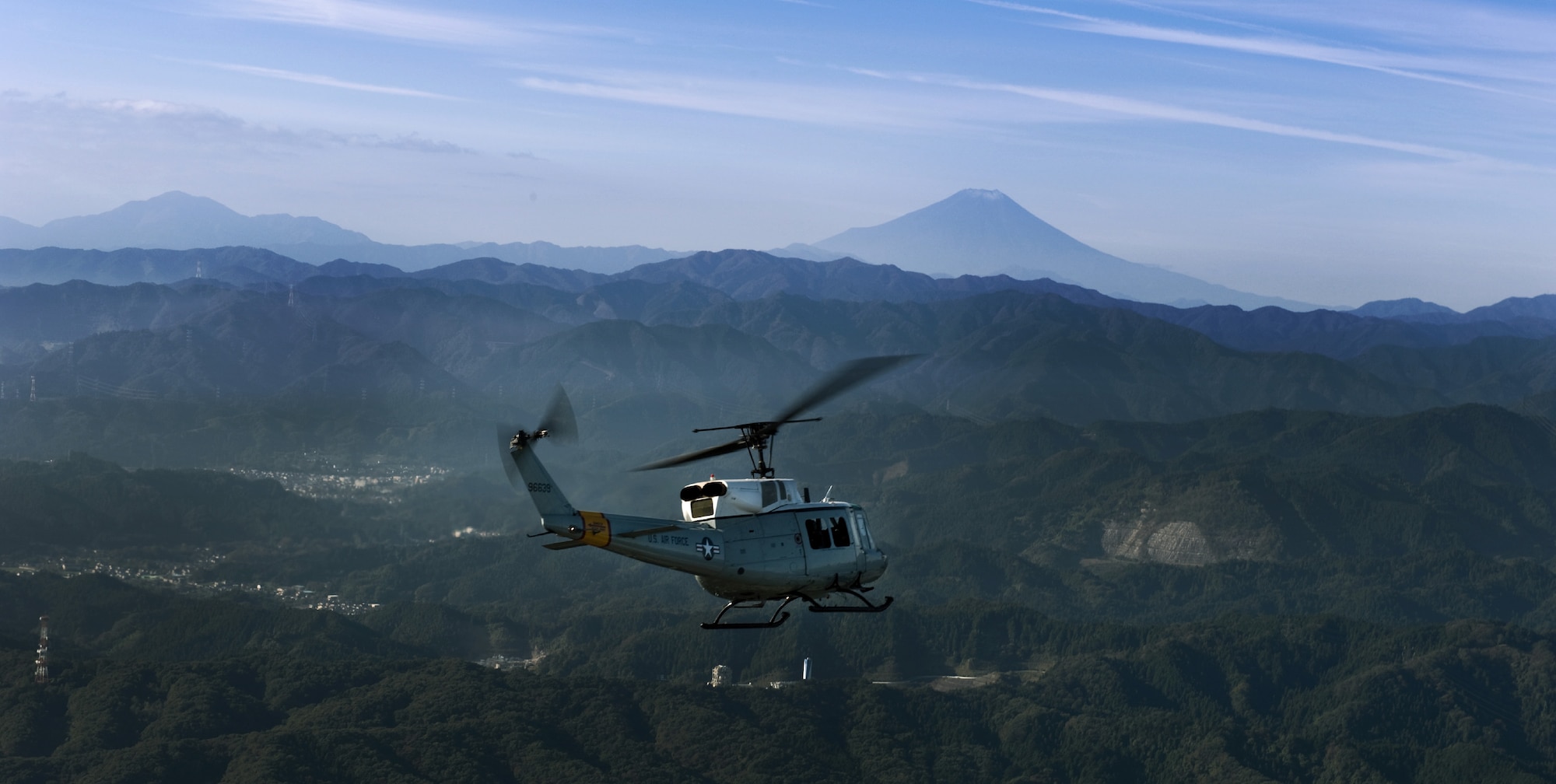 OVER JAPAN -- A UN-H1 Huey flies in the Kanto Plains region Nov. 2, 2011, from Yokota Air Base, Japan. The aircraft flew in an exercise known as the Samurai Surge, a day dedicated to practicing aerial formations and other aircraft maneuvers. (U.S. Air Force photo by/Airman John D. Partlow)