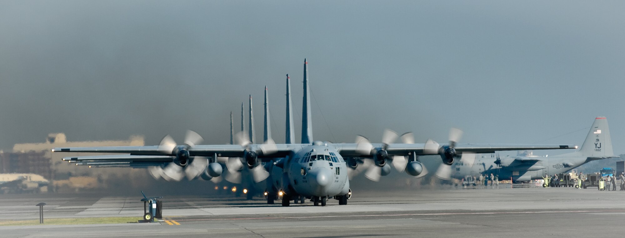 YOKOTA AIR BASE, Japan -- A line of C-130 Hercules from the 36th Airlift Squadron taxi out for a mission during a six-ship sortie Nov. 2, 2011, at Yokota Air Base, Japan. The sortie was part of the Samurai Surge. (U.S. Air Force photo/Airman John D. Partlow)