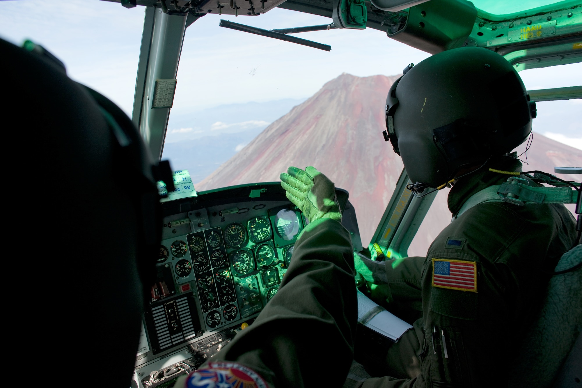OVER MOUNT FUJI, Japan -- Lt. Col. Joshua Bowman (left) and 1st Lt. Sean Abling (right), both 459th Airlift Squadron UH-1 Huey pilots, fly over Mount Fuji Nov. 2, 2011. The Samurai Surge an all day flying exercise tested pilots from the 459th AS and 36th AS in several different areas. (U.S. Air Force photo/Osakabe Yasuo)