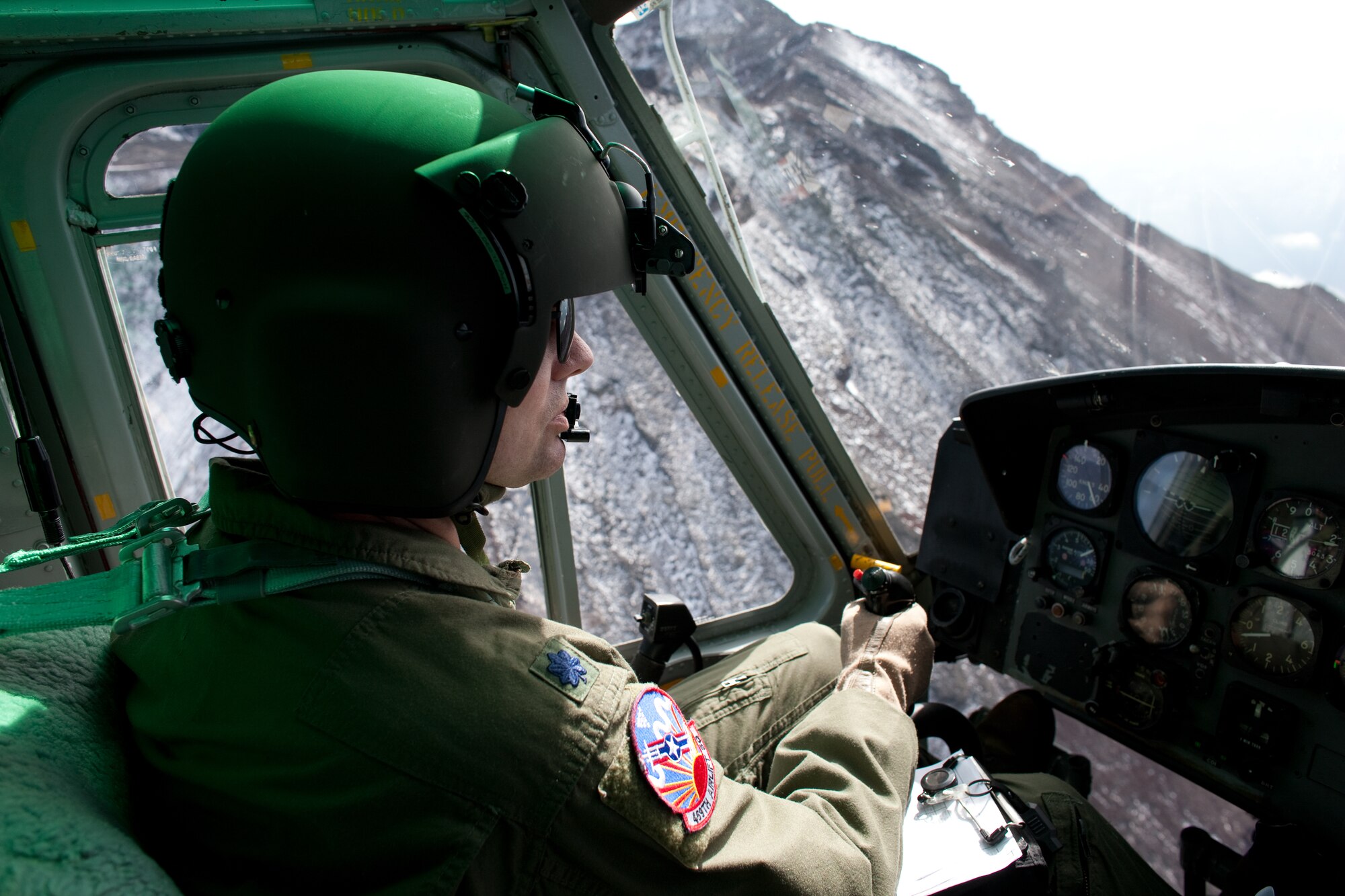 OVER JAPAN --  Lt. Col. Joshua Bowman,459th Airlift Squadron UH-1 Huey pilot, flies over Mount Fuji Nov. 2, 2011. The Samurai Surge an all day flying exercise tested pilots from the 459th AS and 36th AS in several different areas. (U.S. Air Force photo/Osakabe Yasuo)