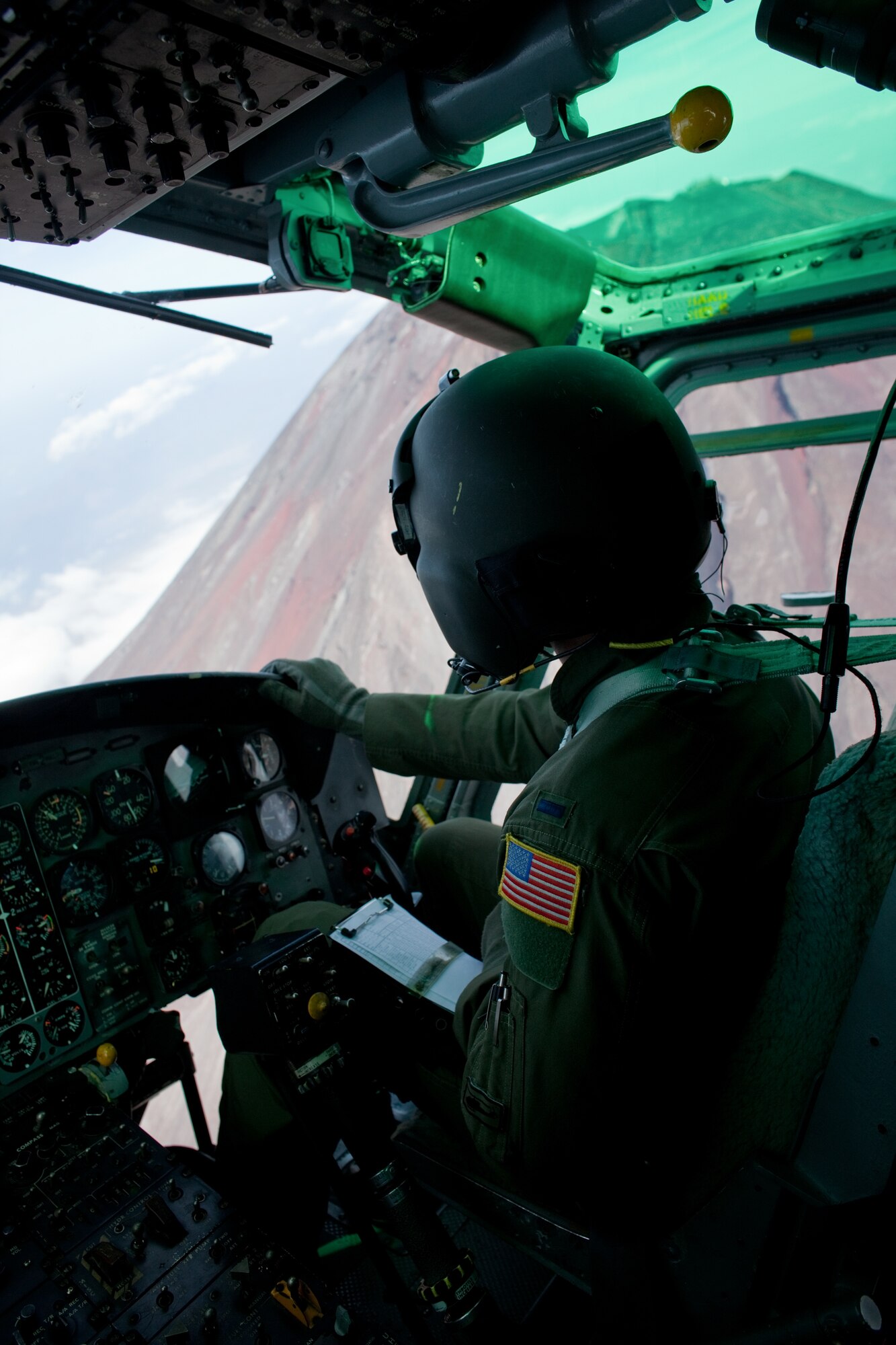OVER JAPAN -- 1st Lt. Sean Abling, 459th Airlift Squadron UH-1 Huey co-pilot, flies over Mount Fuji Nov. 2, 2011. The Samurai Surge an all day flying exercise tested pilots from the 459th AS and 36th AS in several different areas. (U.S. Air Force photo/Osakabe Yasuo)
