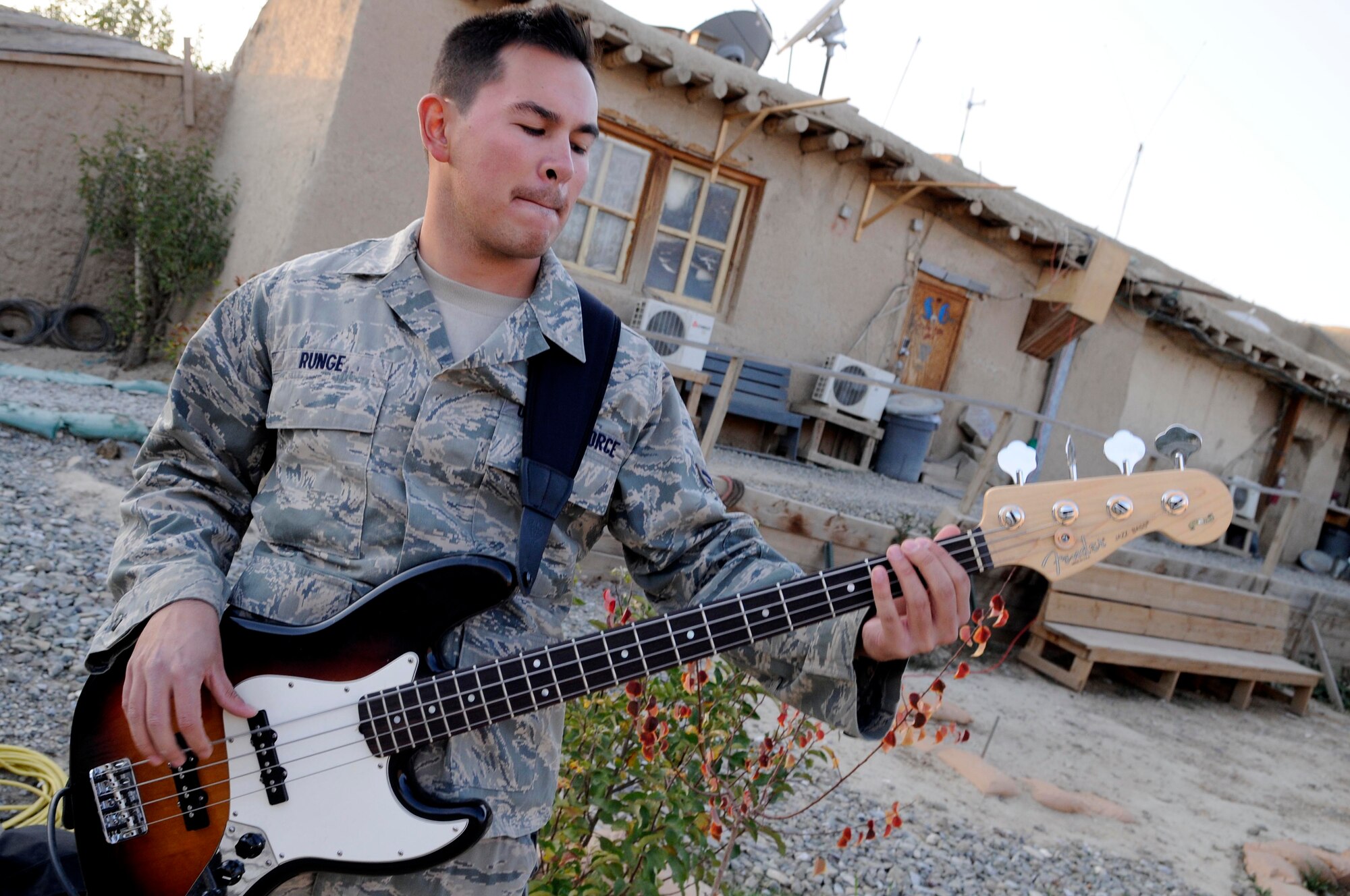 Airman 1st Class Philip Runge, U.S. Air Forces Central band ‘Top Cover’ guitarist, from Garland, Texas, plays for the troops on Forward Operating Base Gardez, Oct. 28, 2011. The band was invited to play as part of a morale day for FOB Gardez. (Photo by Senior Airman Wesley Farnsworth)