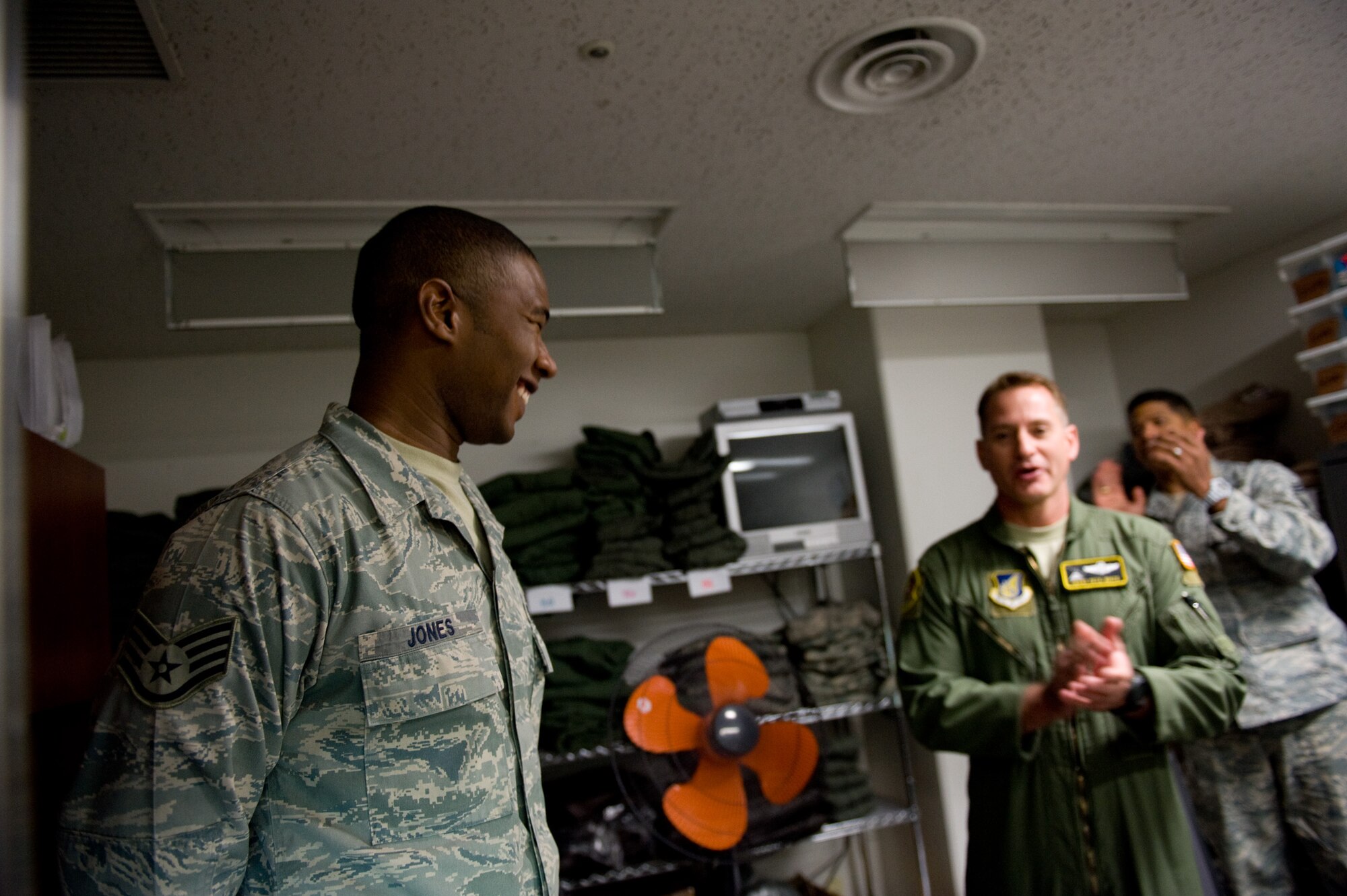 YOKOTA AIR BASE, Japan -- Staff Sgt. Bobby Jones, 36th Airlift Squadron C-130 Hercules flight engineer, receives a surprise visit from the Yokota Chiefs' Group at Yokota Air Base, Japan, Nov. 3, 2011. Jones has earned the Sharp Troop Award, honoring his hard work and dedication. (U.S. Air Force photo/Airman 1st Class Krystal M. Garrett)