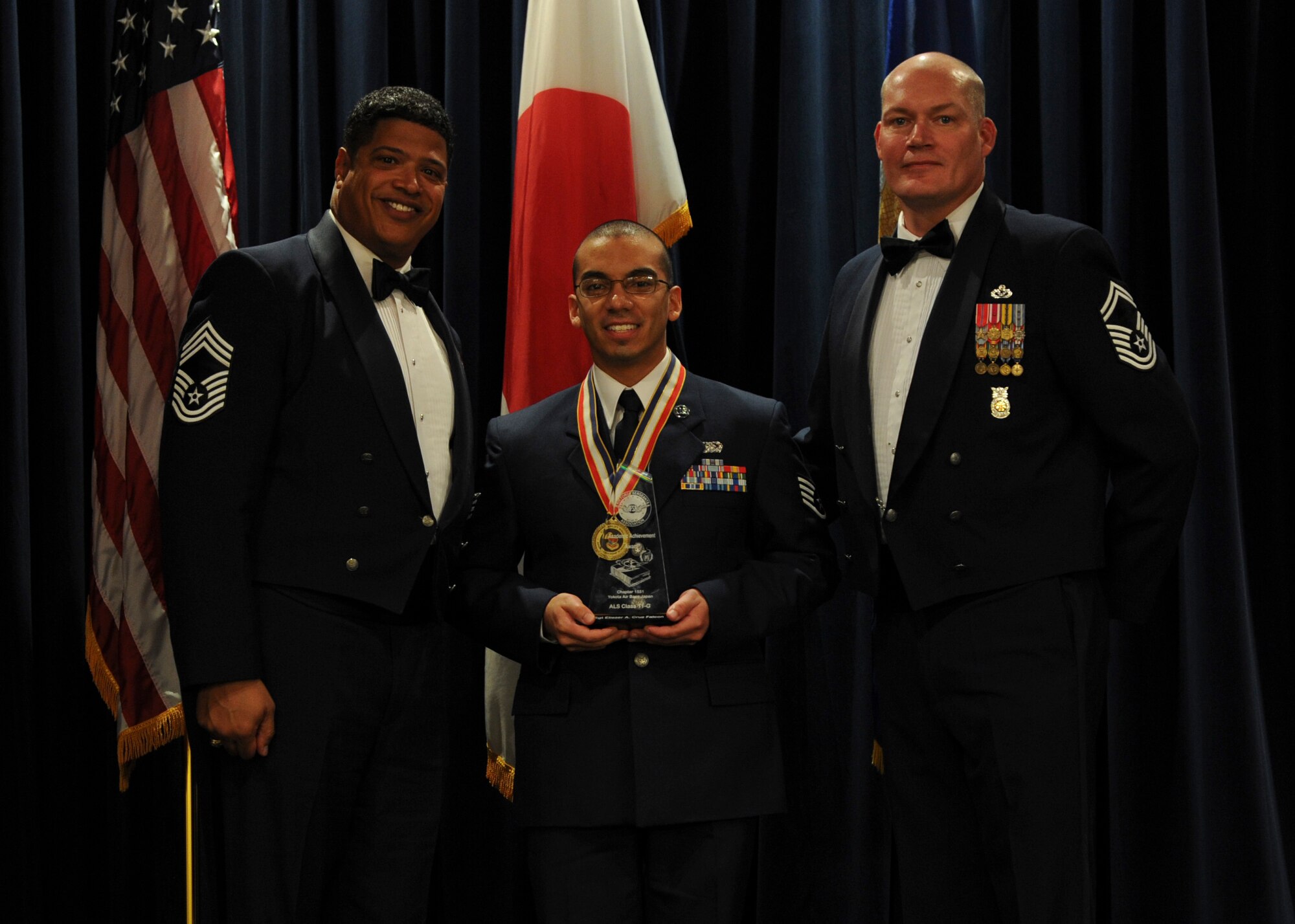 YOKOTA AIR BASE, Japan -- Staff Sgt. Eliezer Cruz Falcon, 374th Communications Squadron, received the Academic Achievement Award, during the Airman Leadership School graduation ceremony at Yokota Air Base, Japan, Nov, 2, 2011. (U.S. Air Force Photo/Staff Sgt. Stacy Moless)