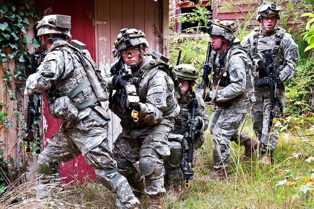 Paratroopers clear a compound of insurgents during a field training exercise on Fort Bragg, N.C., Oct. 28, 2011. The paratroopers are assigned to the 82nd Airborne Division's 1st Brigade Combat Team. The troops are taking part in two weeks of counterinsurgency training in preparation for deployment to Afghanistan.
