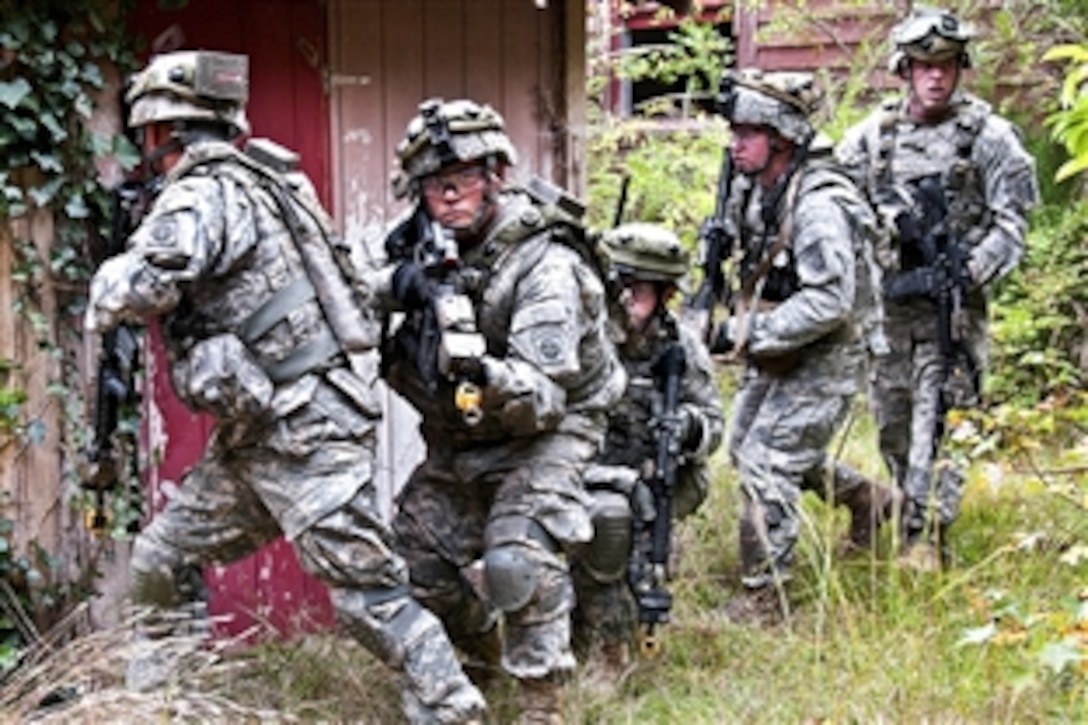 Paratroopers clear a compound of insurgents during a field training exercise on Fort Bragg, N.C., Oct. 28, 2011. The paratroopers are assigned to the 82nd Airborne Division's 1st Brigade Combat Team. The troops are taking part in two weeks of counterinsurgency training in preparation for deployment to Afghanistan. 