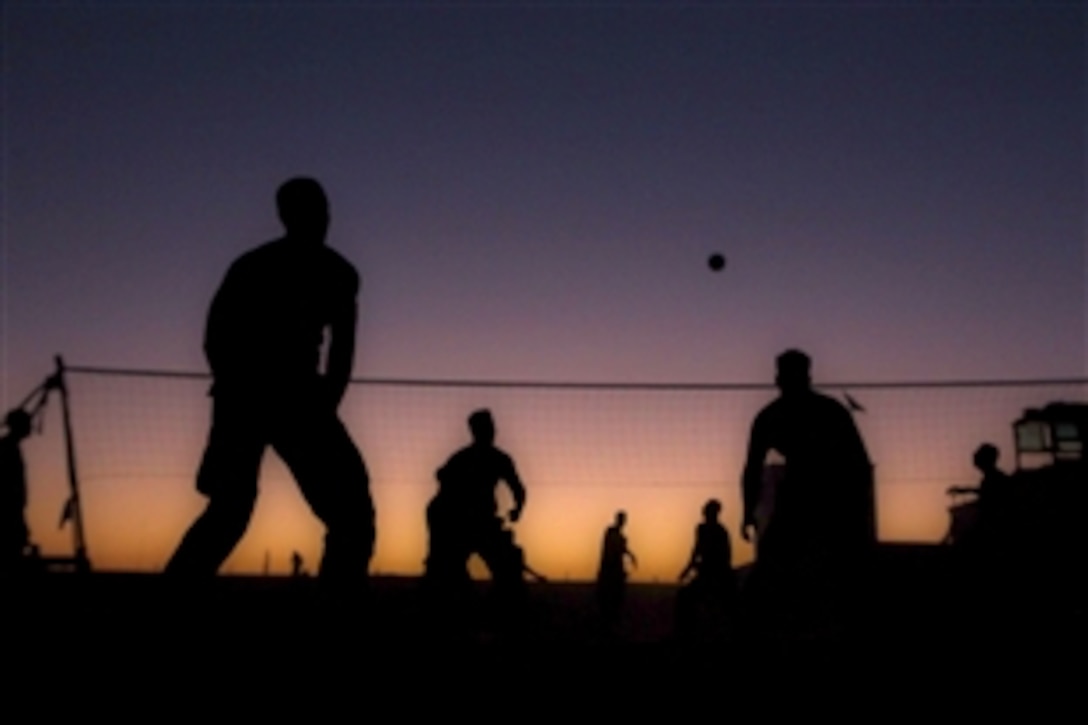 U.S. Marines play a game of volleyball after a 14-kilometer patrol alongside Afghan National Army soldiers with the 1st Kandak, 1st Brigade, 215th Corps in the Nawa district, Afghanistan, Nov. 3. 2011. Once inside the walls of the Loy Kolay precinct, an ANA security outpost, the Marines began playing as the sun set. The Marines are assigned to the 1st Battalion, 9th Marine Regiment.
