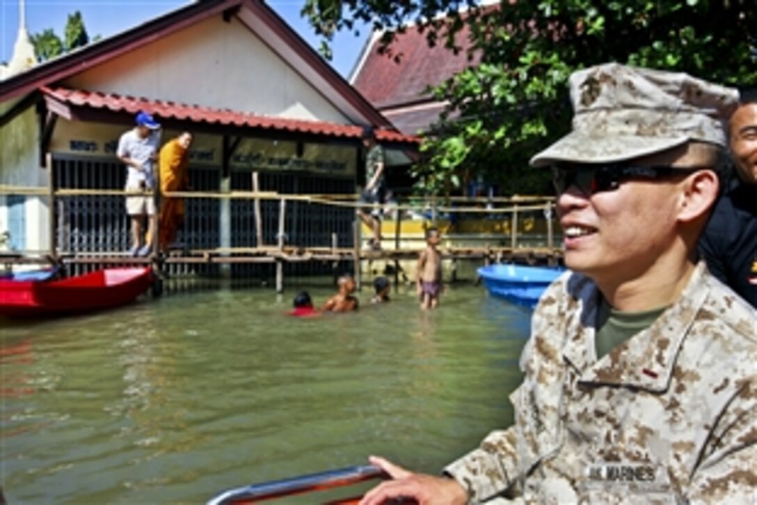 U.S. Marine Chief Warrant Officer 4 Natee Kietchai conducts an assessment of Lopburi, Thailand, Oct 30, 2011. Kietchai is the Thai subject matter expert assigned to the III Marine Expeditionary Force's humanitarian assistance survey team. Sixty-one provinces and 8.2 million people have been affected by the floods caused by an abnormal monsoon season.