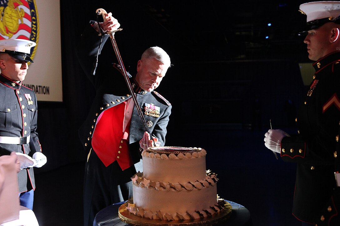 Gen. James F. Amos, commandant of the Marine Corps, cuts a piece of cake during a Marine Corps Birthday Ball ceremony aboard the Intrepid Sea, Air and Space Museum Complex Nov. 3. Amos, along with the Marines of Marine Barracks Washington celebrated the 236th Marine Corps birthday with Marines in the New York area.