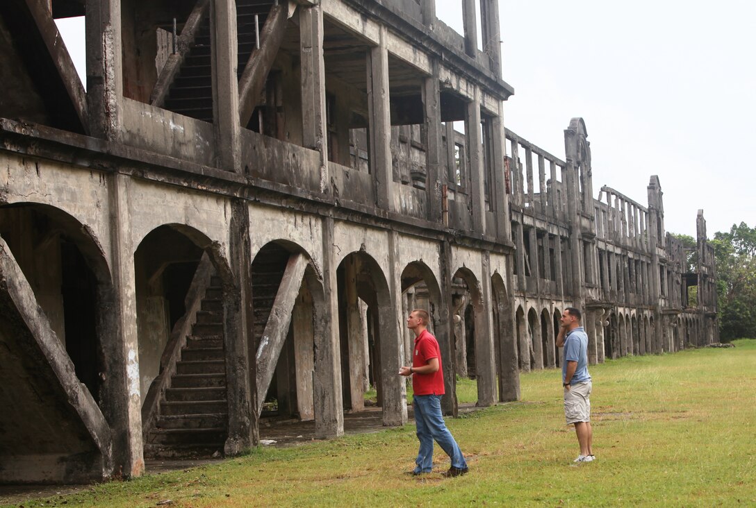 Marines and Sailors of Combat Logistics Battalion 31 and Marine Medium Helicopter Squadron 265 (Reinforced), both with the 31st Marine Expeditionary Unit, explore the historical site of a 1942 military barracks here during a tour Nov. 4, 2011.  The barracks was where U.S. Marines of the 4th Marine Regiment were billeted days before the American-Filippino defense of Corregidor began. Service members of the 31st MEU toured Corregidor after the completion of the Amphibious Landing Exercise, designed to enhance interoperability between the military forces, and continuing the allied relationship that has existed for more than half a century.