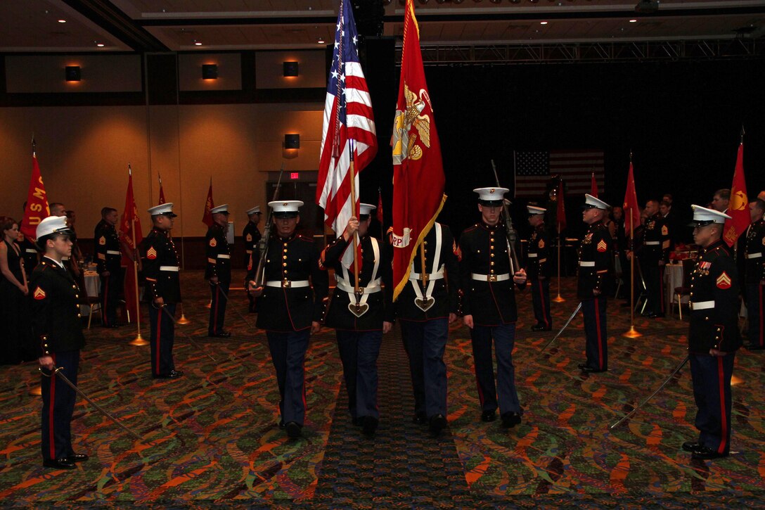 The Honor Guard stands at attention as the color guard for Recruiting Station Twin Cities’ 236th Marine Corps Birthday celebration marches past following the entrance of the guest of honor. The event was held at the Treasure Island Resort Nov. 4. For additional imagery from the event, visit www.facebook.com/rstwincities.
