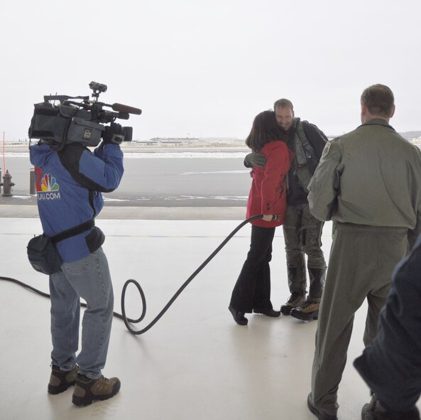 Upon landing Lt. Col. David Piffarerio, 302nd Fighter Squadron commander, is congratulated by his wife Jennifer. This flight marked Piffarerio’s 1,000 flight hour in the F-22 making him the first Air Force pilot to reach this milestone. Piffarerio is a Reservist assigned to the 477th Fighter Group of which the 302nd Fighter Squadron falls under.  (U.S. Air Force photo/Capt. Ashley Conner)