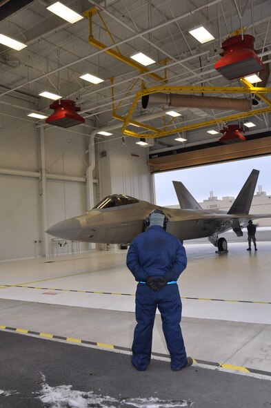 Staff Sgt.  Hank Robinson, 525th Aircraft Maintenance Squadron crew chief, prepares Lt. Col. David Piffarerio, 302nd Fighter Squadron commander, for take-off.  This flight marked Piffarerio’s 1,000 flight hour in the F-22 making him the first Air Force pilot to reach this milestone. Piffarerio is a Reservist assigned to the 477th Fighter Group of which the 302nd Fighter Squadron falls under.  (U.S. Air Force photo/Capt. Ashley Conner)