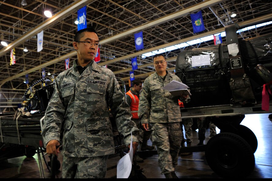 MISAWA AIR BASE, Japan – U.S. Air Force Tech. Sgt. Lowell Lomibao, left, and Tech. Sgt. Han Mac, 35th Logistics Readiness Squadron, check cargo during an operational readiness exercise here Nov. 4. The 35th Fighter Wing is currently going through an ORE in preparation for an operational readiness inspection this December. (U. S.  Air Force photo/Staff Sgt. Nathan Lipscomb)