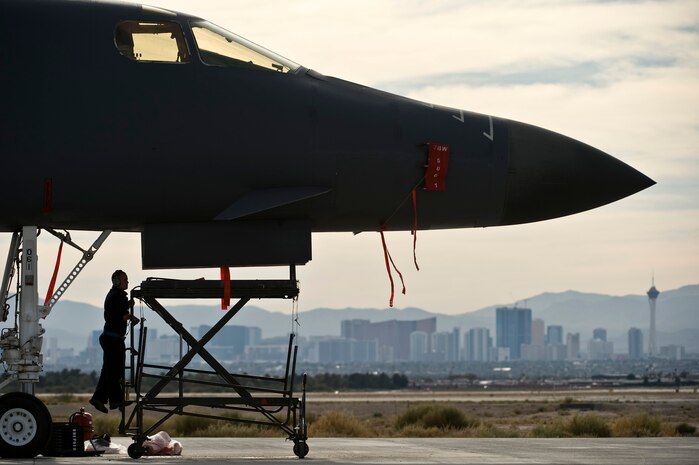 U.S. Air Force Tech. Sgt. Richard Townzen, crew chief, 7th Aircraft Maintenance Squadron, Dyess Air Force Base, Texas, prepares to inspect underneath a B-1 Lancer during the integrated tactics phase of the U.S. Air Force Weapons School Nov. 3, 2011, at Nellis Air Force Base, Nev. The 77th Weapons Squadron, part of the U.S.A.F.W.S., provide instructional flying and tactics training for students piloting the B-1 Lancer. (U.S. Air Force photo by Senior Airman Brett Clashman/Released)