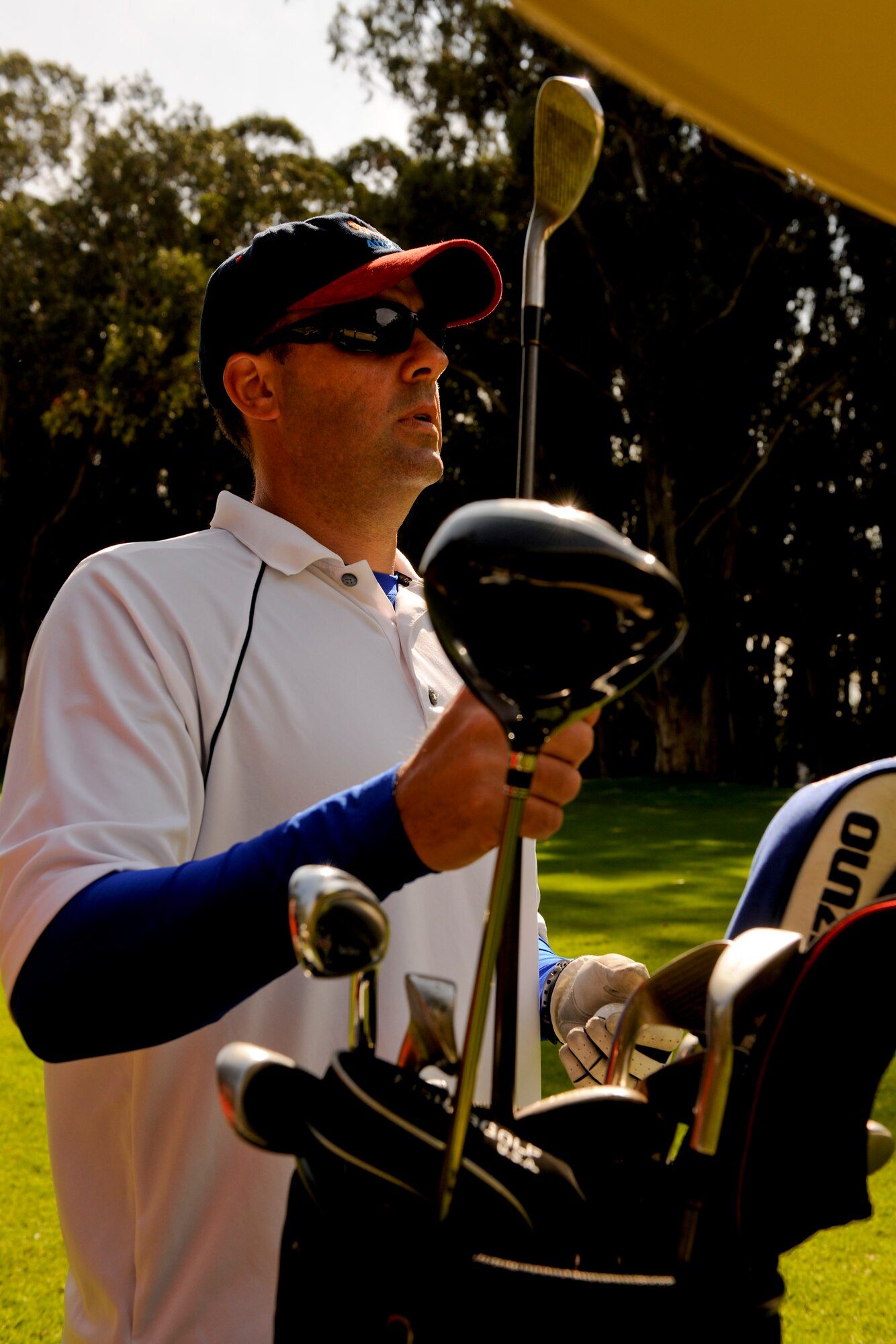 VANDENBERG AIR FORCE BASE, Calif. --Royal Australian Air Force Squadron Leader Chris Robson, 614 Air Operations Center, selects a club during a golf tournament hosted by members of Vandenberg's Commonwealth here Friday, Nov. 4, 2011. The event was a small gesture of appreciation for Vandenberg members for helping the Commonwealth personnel and their families feel welcome while thousands of miles away from their homeland. (U.S. Air Force/Staff Sgt. Levi Riendeau)

