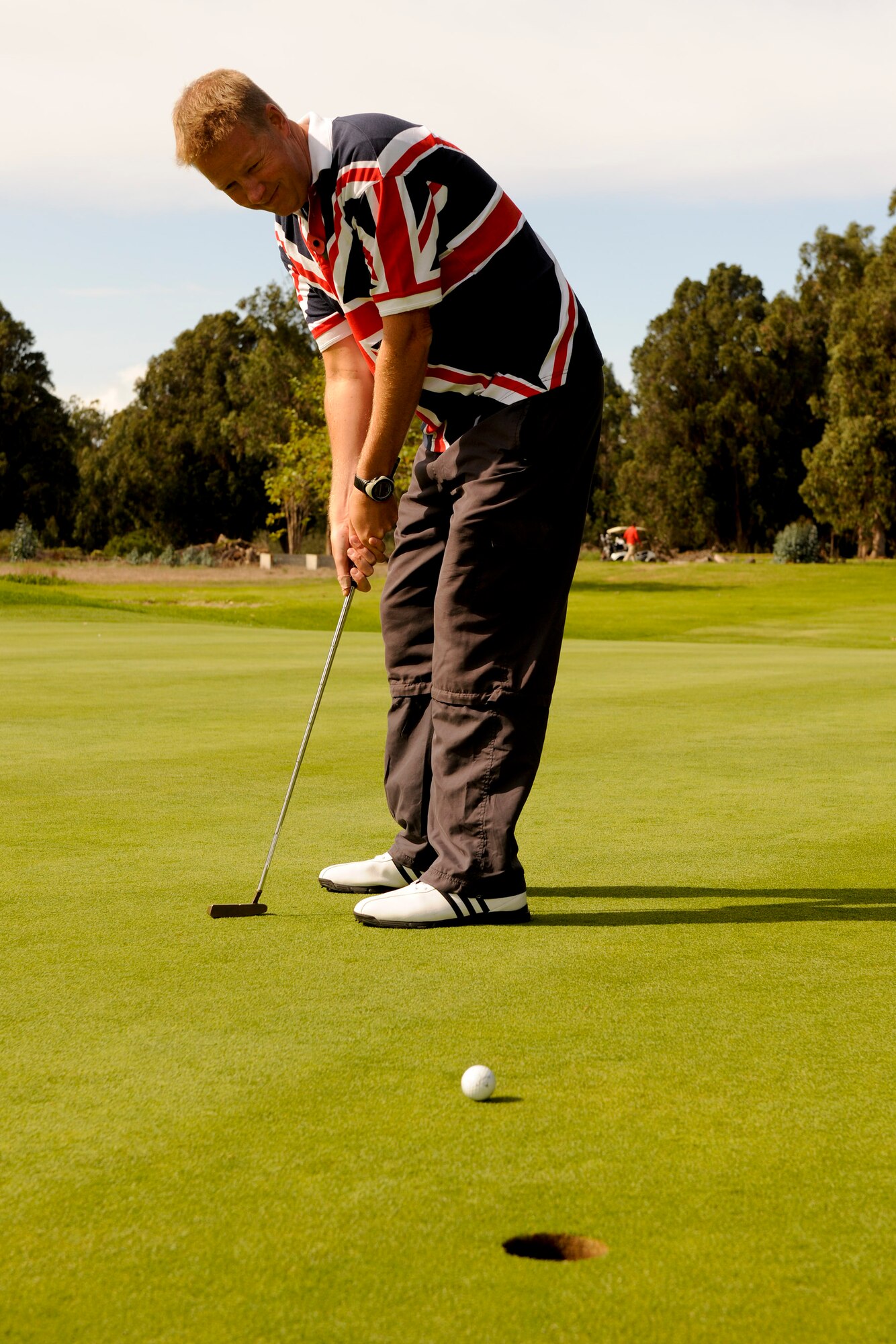 VANDENBERG AIR FORCE BASE, Calif. -- Royal Air Force Wing Commander Rick Box, Joint Space Operations Center British military exchange officer, takes a putt during a golf tournament hosted by members of Vandenberg's Commonwealth here Friday, Nov. 4, 2011. The event was a small gesture of appreciation for Vandenberg members for helping the Commonwealth personnel and their families feel welcome while thousands of miles away from their homeland. (U.S. Air Force/Staff Sgt. Levi Riendeau)