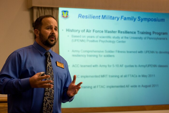Wayne Ojala, 99th Force Support Squadron coomunity readiness consultant, briefs at the Resilient Military Family Symposium Nov. 4, 2011, at Nellis Air Force Base, Nev. The symposium is designed to give family members the tools, knowledge, and resources to empower themselves to adapt to the rigors of the military environment. (U.S. Air Force photo by Staff Sgt. Christopher Hubenthal/Released)