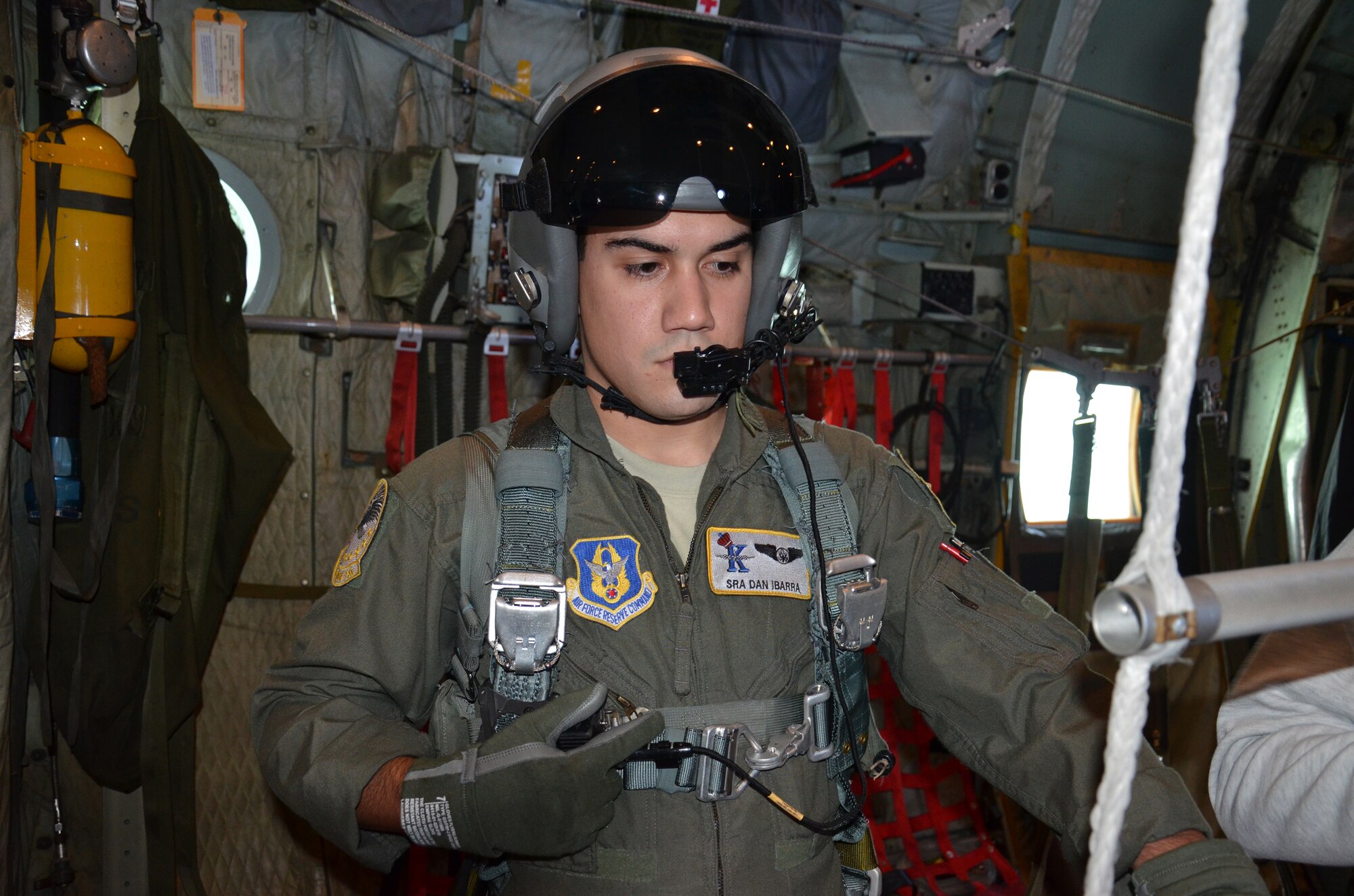 PATRICK AIR FORCE BASE, Fla.- Senior Airman Dan Ibarra, an HC-130P/N King aircraft loadmaster, takes a moment to communicate with other crew members aboard the HC-130P/N King refueling aircraft. Air crew reservists and pararescuemen from the 920th Rescue Wing here performed a demo for the Cocoa Beach Air Show Nov. 4. During the Cocoa Beach Air Show the 920th RQW will perform various demonstrations including its maritime operations. (U.S. Air Force photo/Capt. Cathleen Snow)

