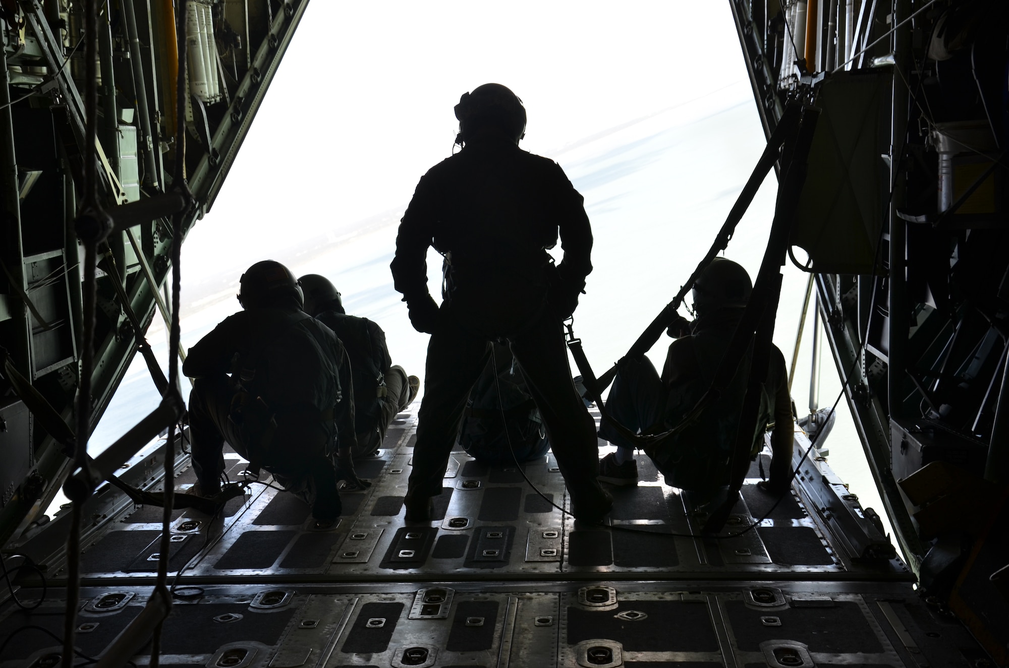 PATRICK AIR FORCE BASE, Fla.- Members of the local media sit on the HC-130P/N King aircraft ramp and enjoy the breeze and above Cocoa Beach. Local media covered the 920th Rescue Wing's Cocoa Beach Air Show demo Nov. 4. Pararescuemen performed free-fall jumps from the back of a HC-130. Pararescuemen and other 920th RQW assists, including the HC-130 and HH-60G Pave Hawk helicopter, will be participating in the air show. (U.S. Air Force photo/Capt. Cathleen Snow)