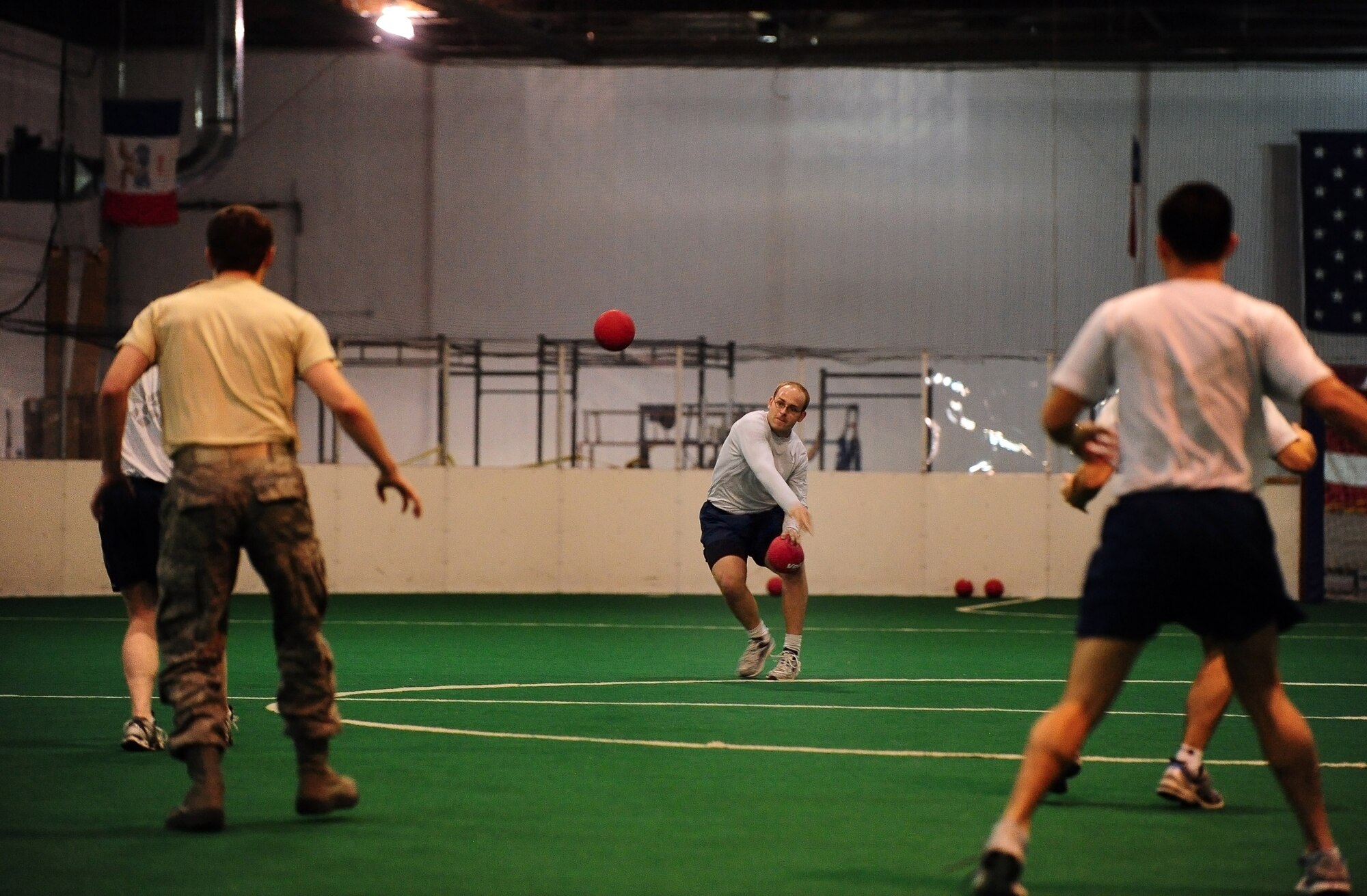 U.S. Air Force Staff Sgt. Bill Zipsey, of the 1st Airborne Command and Control Squadron, faces an onslaught of dodgeballs as he remained the last man standing on his team during the dodgeball tournament portion of the annual Wingman Day held in various locations around Offutt Air Force Base, Neb., Nov. 4. Wingman Day events are used to promote teamwork and camaraderie. (U.S. Air Force photo by Josh Plueger/Released)