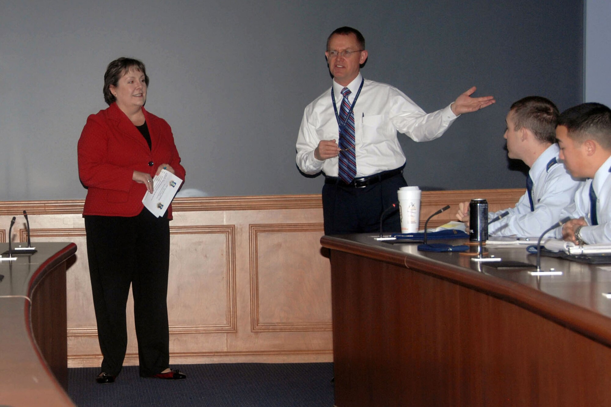 HANSCOM AIR FORCE BASE, Mass. - Susan Thornton, Engineering and Technical Management Directorate director and Herb Grover, Command and Control Enterprise Integration Facility team lead and member of the Electronic Systems Center Innovation Challenge Administrative Board, present information about the Challenge to team members during a kick-off Oct. 31. The Challenge is a competition between two teams of junior engineers who work to find the best technical solution for a warfighter need.  (U.S. Air Force photo by Linda LaBonte Britt)