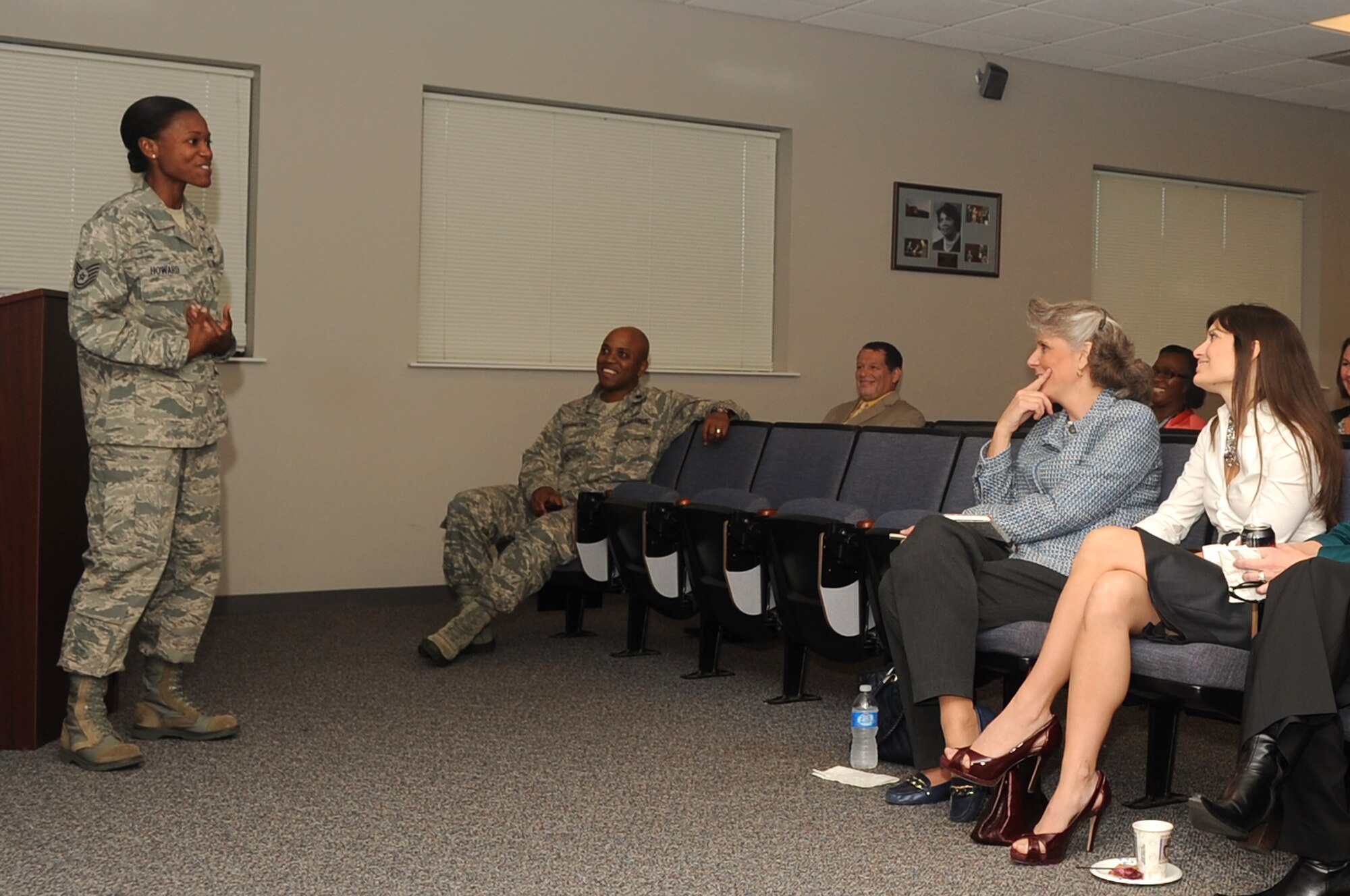 Mrs. Kathy Wells (center), wife of Maj. Gen. Lawrence Wells 9th Air Force commander, attends a slide show presentation by U.S. Air Force Tech. Sgt. April Howard, Airman Leadership School commandant, during her visit to the Shaw Education Center, Shaw Air Force Base, S.C., Nov. 2, 2011. Wells and his wife visited multiple units on base to visit with Shaw Airmen and thank them for their hard work. (U.S. Air Force photo by Airman 1st Class Hunter Brady/Released)




