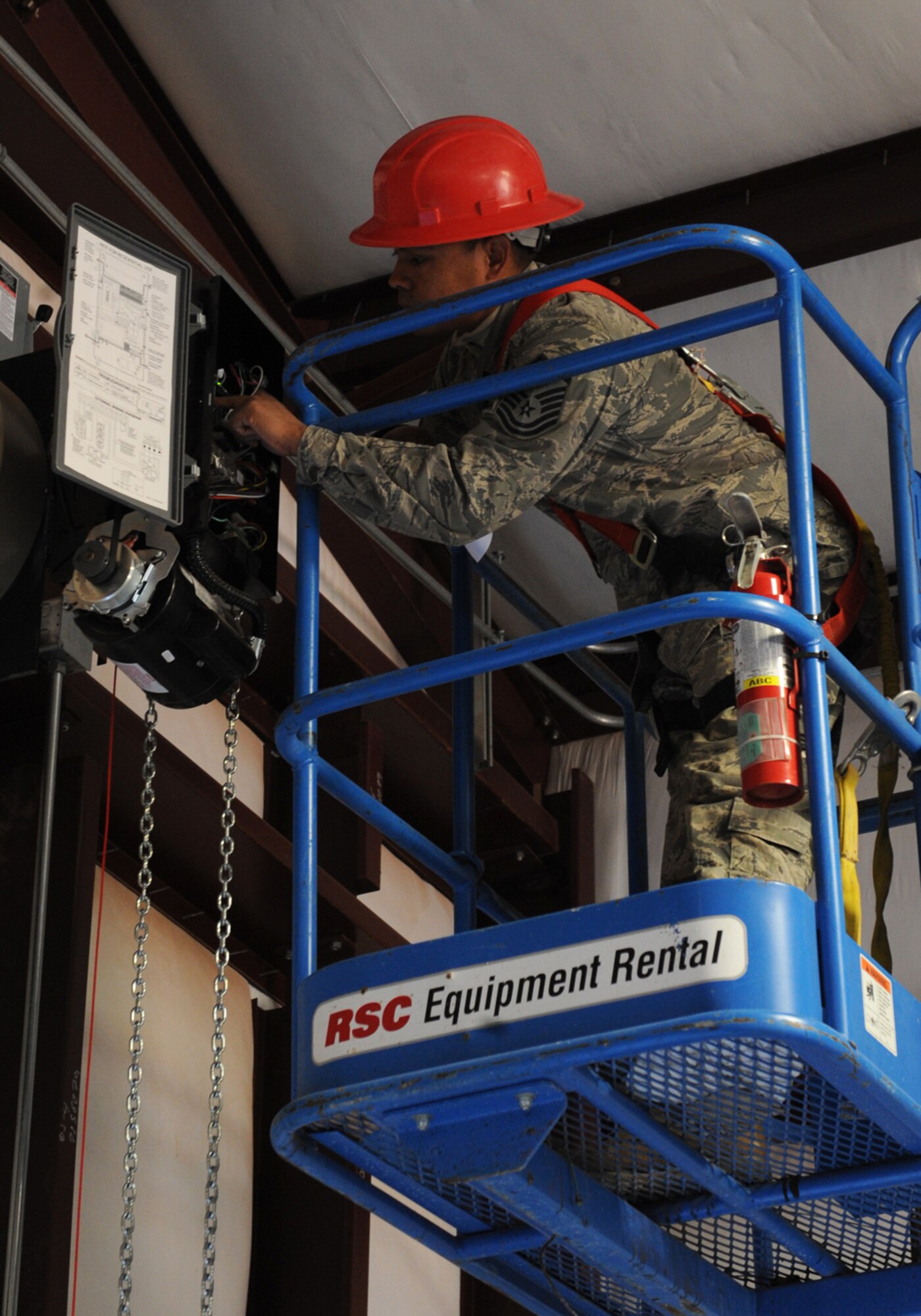 Master Sgt. Andrew Campos, 819th Red Horse Squadron, Malstrom Air Force Base, Mont., installs electricity to a door on a new pre-engineered building Nov. 3, 2011, at Dyess AFB, Texas. Red Horse is constructing a 8,500-square-foot facility for 7th Civil Engineer Squadron craftsmen to perform maintenance duties and will also consolidate three other facilities being used by 7 CES. (U.S. Air Force photo by Airman 1st Class Peter Thompson/ Released)