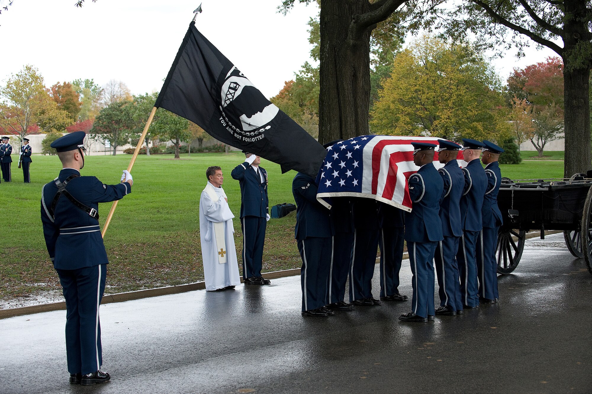 A team from the U.S. Air Force Honor Guard, Joint Base Anacostia-Bolling, D.C., removes the remains of Air Force Col. Gilbert S. Palmer, Jr, from a caisson Nov. 1, 2011 at Arlington National Cemetery. Palmer's aircraft crashed on Feb. 27, 1968 in an unknown location. His remains were identified earlier this year. (U.S. Air Force photo/Steve Kotecki)