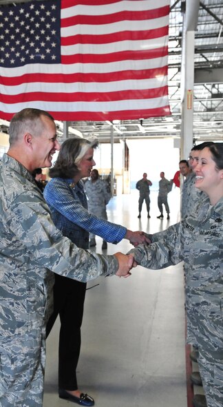 U.S. Air Force Maj. Gen. Lawrence Wells, 9th Air Force commander, shakes the hand of Staff Sgt. Serena Drinkwater, 20th Component Maintenance Squadron aerospace propulsion technician, Nov. 3, 2011, Shaw Air Force Base, S.C. General Wells and Mrs. Kathy Wells, took an official tour of the 20th Fighter Wing to gain insight into the mission and speak with Airmen from units across the base to hear their concerns.  (U.S. Air Force photo by Airman 1st Class Amber E. N. Jacobs/Released)  