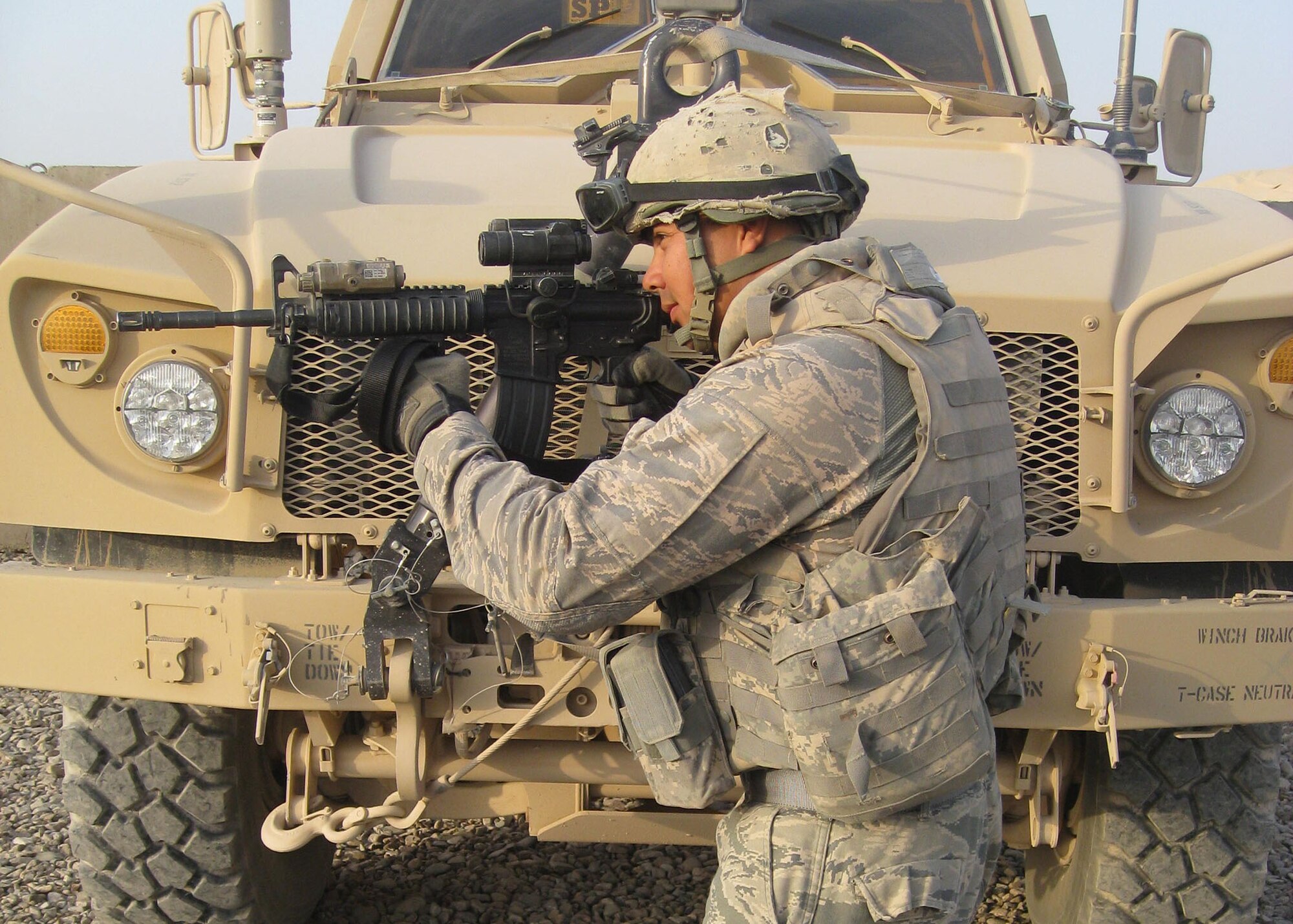 Deployed Senior Airman Alberto Moran of the 146th Security Forces Squadron looks through the scope of his rifle during a routine patrol on October 25, 2011. Alberto Gatlin is on a six month AEF deployment rotation in Afghanistan.  Photo Credited by the 146th Security Forces Squadron. 