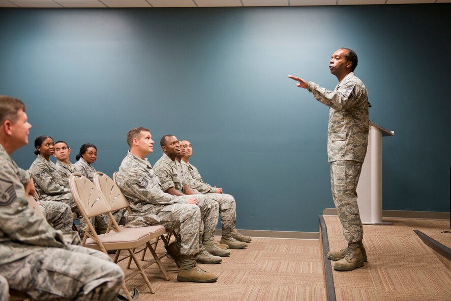 U.S. Air Force Chief Master Sgt. Joe Romeo, Air Combat Command services functional manager, speaks to 23rd Force Support Squadron Airmen at Moody Air Force Base, Ga., Nov. 2, 2011. Romeo talked about the level of professionalism he witnessed during his visit to Moody and how the Air Force is in better hands with today’s Airmen leading the future. He also shared a story of how he was chased by a bear at Hurlburt Field, Fla., while conducting physical training. (U.S. Air Force photo by Staff Sgt. Jamal D. Sutter/Released)  
