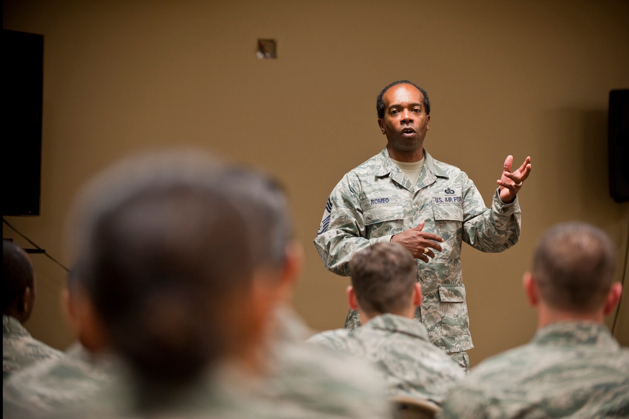 U.S. Air Force Chief Master Sgt. Joe Romeo, Air Combat Command services functional manager, speaks to 23rd Force Support Squadron Airmen at Moody Air Force Base, Ga., Nov. 2, 2011. Romeo was part of a team that visited to inspect Moody’s dining facility and flight kitchen for the 2011 John L. Hennessy Award. The award recognizes the Air Force’s Food Service programs. (U.S. Air Force photo by Staff Sgt. Jamal D. Sutter/Released)  
