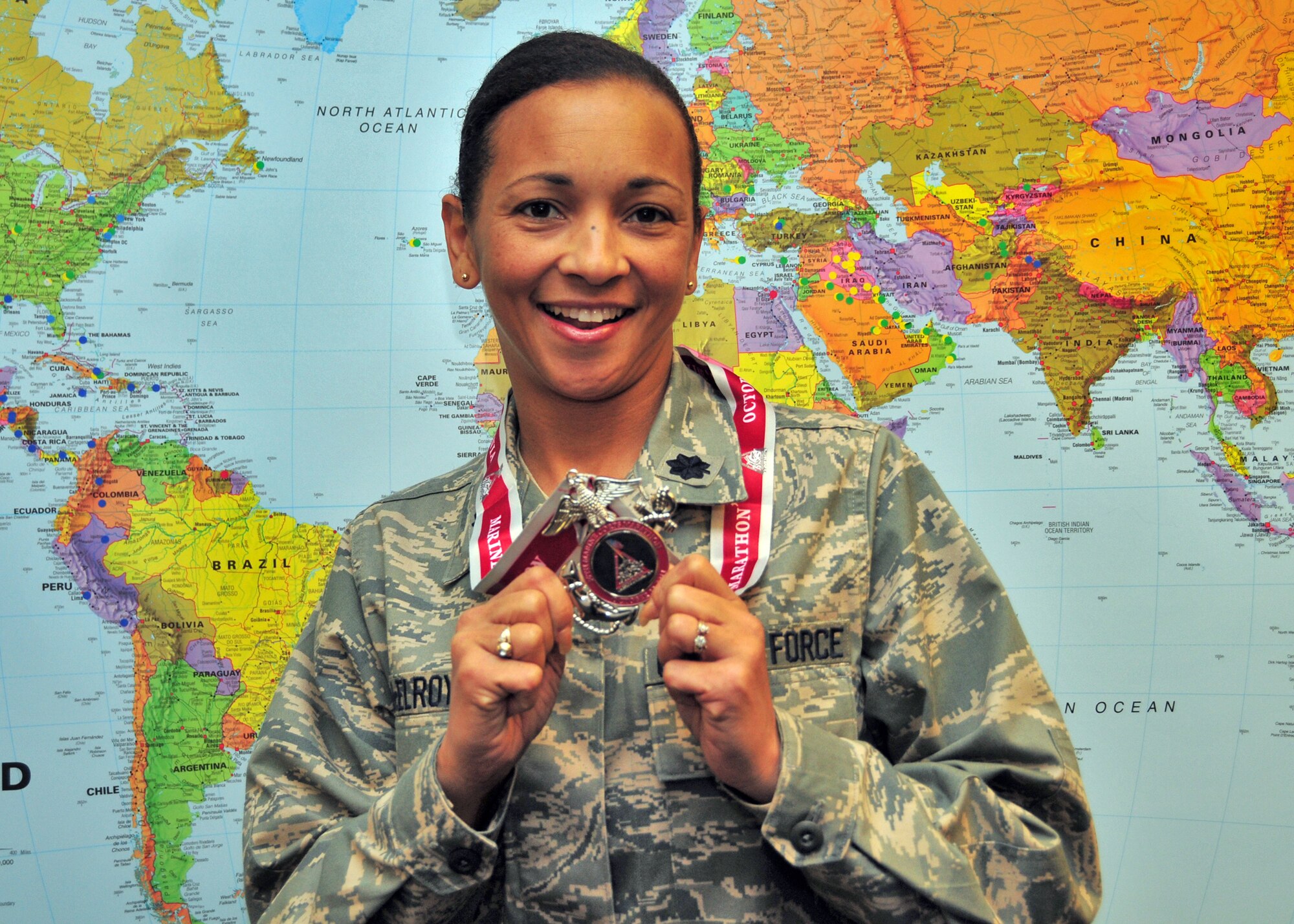 Lt. Col. Maria McElroy poses with her Marine Corps Marathon medal November 4, 2011 Niagara Falls Air Reserve Station, NY. Lt. Col McElroy was awarded the medal for her completion of the Marine Corps Marathon held in Washington, DC. (U.S. Air Force photo by Staff Sgt. Joseph McKee)