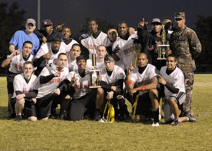 Left to right, top to bottom: Michael Price, Gilmore Brown, Christopher Macklin, Darrel Green, Ricky Guajardo, Michael Smith, Nakeithian Phillips, Darrell Harmon, Levon Harrison, Victor Solis, Robert Snowden, Ivan Navarro, Nicholas Kaiser, Christopher Lickman, Adrian Fuentes, Aaron Johnson, William Eberle, John Grey and Kyle Bedell gather for the 59th Dental Squadron’s 2011 intramural flag football base championship photo. (U.S. Air Force photo/Robbin Cresswell)