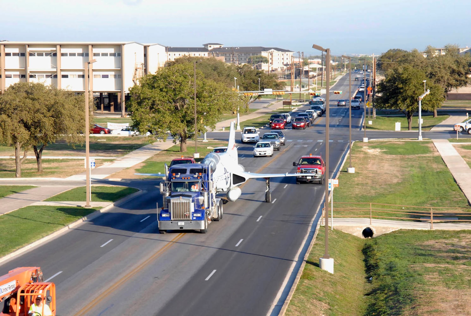 The F-101 Voodoo is transported down Treumper Avenue to its final destination at the Defense Language Institute English Language Center Oct. 22. (U.S. Air Force photo/Alan Boedeker)