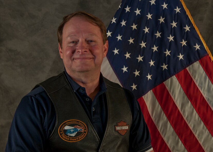 Retired U.S. Air Force Master Sgt. Jerry Childs no longer wears a uniform, but his passion for America and the Armed Forces is still evident. After retiring from Moody Air Force base, Ga., Childs remained working for the Air Force as a civilian. Each morning he raises the flag during reveille, then lowers it each afternoon to be fold and put in its case. He took on a patriotic pastime earlier this year with the Patriot Guard Riders,  a diverse group of bikers from across the nation who have an unwavering respect for those who risk their lives for America’s freedom and security. He plans on staying with the PGRs and participating in the group’s services. (U.S. Air Force photo by Senior Airman Eileen Meier/Released)