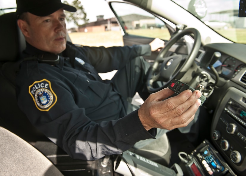 Retired U.S. Air Force Tech. Sgt. David Taylor holds up one of the new devices recently added to the 23rd Security Forces Squadron at Moody Air Force Base, Ga., Nov. 2, 2011. Taylor worked with the SFS while enlisted, and now works as a Department of the Air Force civilian entry controller operating one of the new patrol cars that were put to use two weeks ago. (U.S. Air Force photo by Senior Airman Eileen Meier/Released)