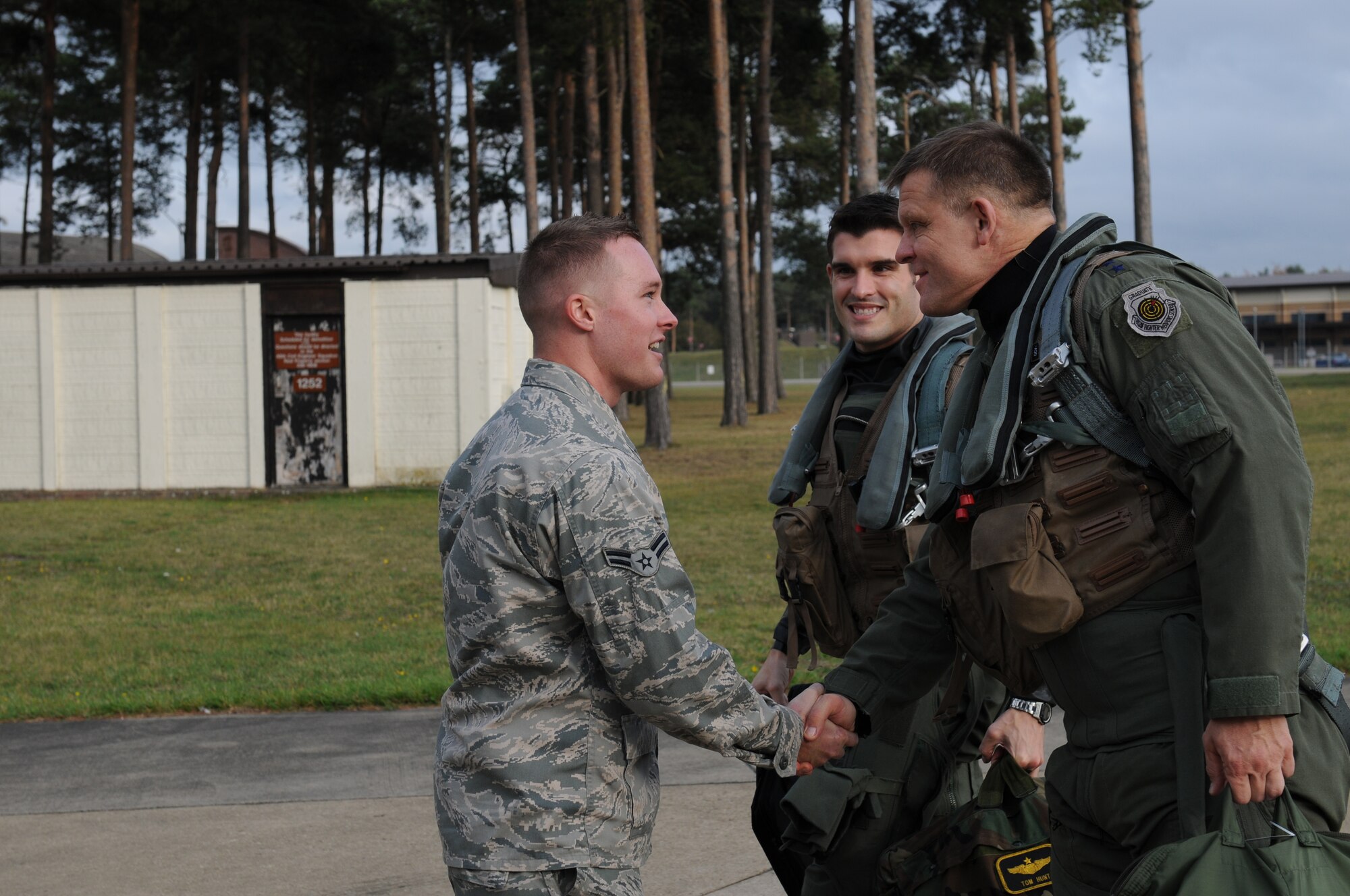 ROYAL AIR FORCE LAKENHEATH, England – Airman 1st Class Adam Kipper, 748th Aircraft Maintenance Unit crew chief, shakes hands with 3rd Air Force Commander Lt. Gen. Frank Gorenc Nov. 3, 2011. Gorenc paid a visit to the 48th Fighter Wing to recognize the outstanding contributions of Liberty Airmen. (U.S. Air Force photo by Airman 1st Class Cory D. Payne)