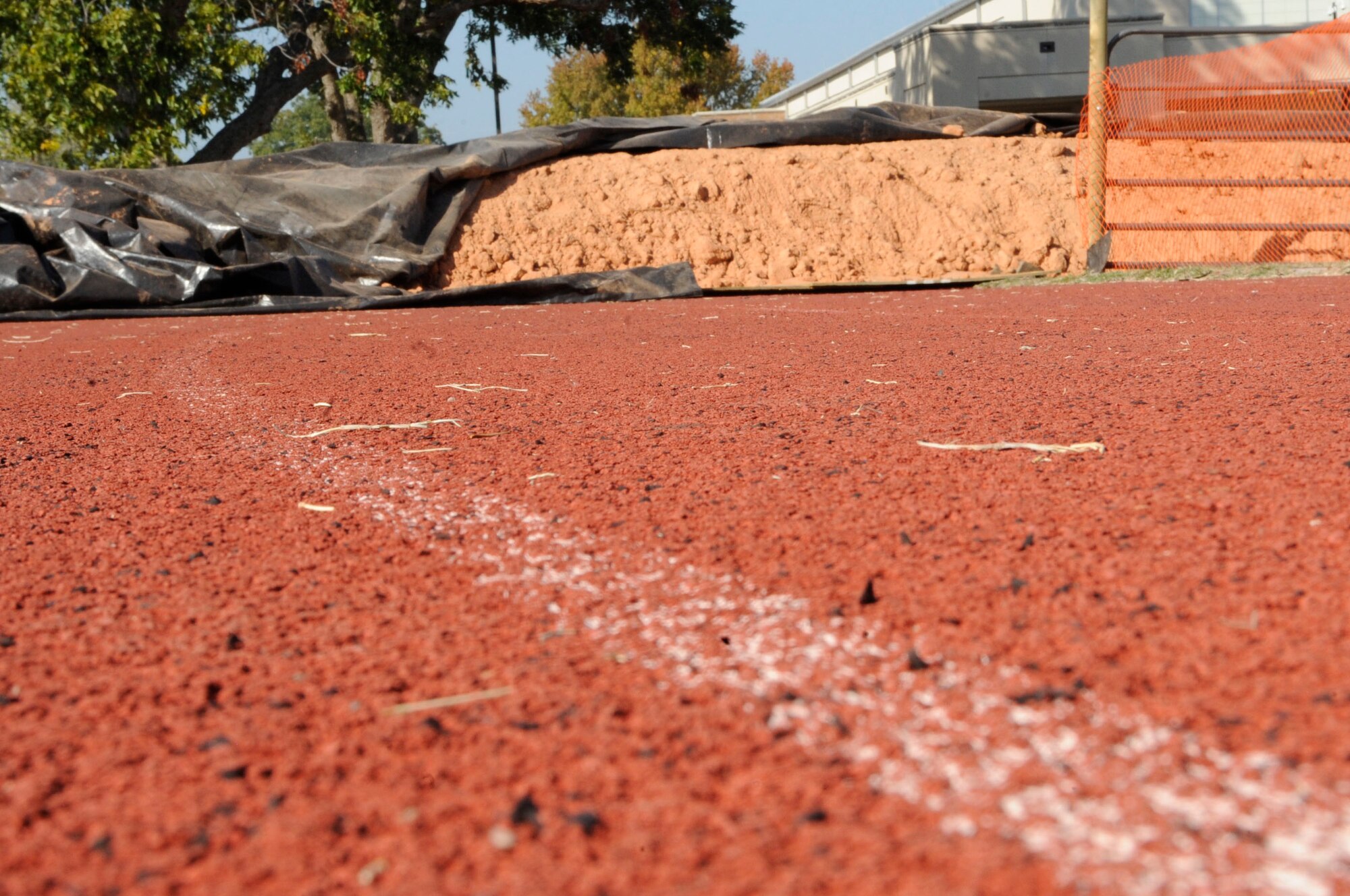 Dirt covers the track outside of the fitness center Nov. 2 on Barksdale Air Force Base, La.  The dirt was put there to protect the track from heavy equipment while the field undergoes renovations.  The track is scheduled to reopen the first week of December. (U.S. Air Force photo/Airman 1st Class Andrea F. Liechti)(RELEASED)