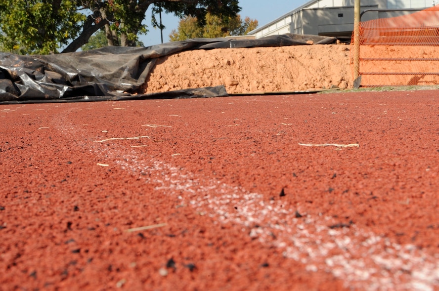 Dirt covers the track outside of the fitness center Nov. 2 on Barksdale Air Force Base, La.  The dirt was put there to protect the track from heavy equipment while the field undergoes renovations.  The track is scheduled to reopen the first week of December. (U.S. Air Force photo/Airman 1st Class Andrea F. Liechti)(RELEASED)