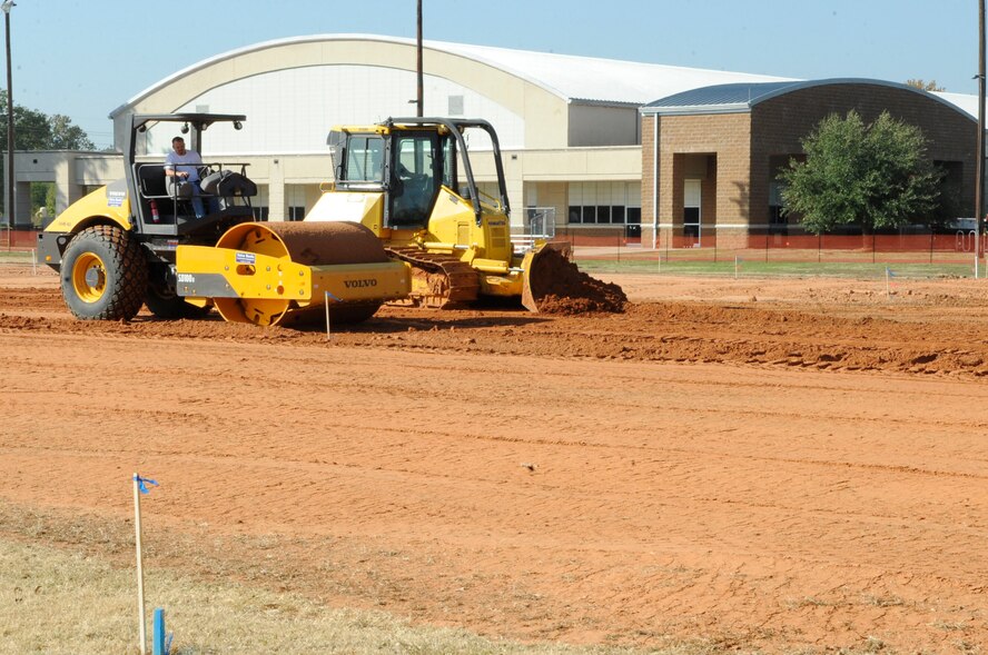 The field outside of the fitness center undergoes renovations Nov. 2 on Barksdale Air Force Base, La.  The renovations include killing weeds, digging up the field, tilling it, raising the dirt up an inch and smoothing it out.  Once completed, new sprinklers will be installed and the sod will be rolled out. (U.S. Air Force photo/Airman 1st Class Andrea F. Liechti)(RELEASED)