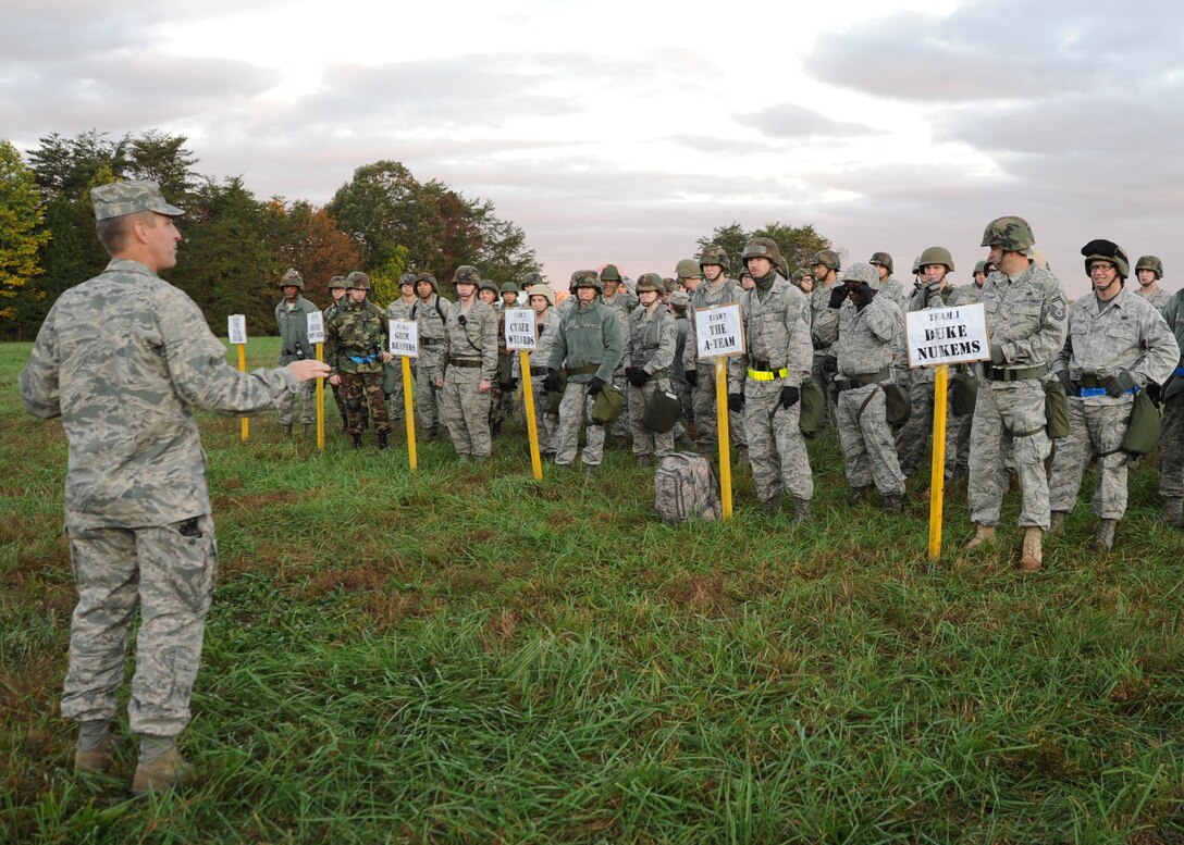 Members of the 844th Communications Group receive a pre-brief before taking part in the annual 844th CG Warrior Day Oct. 21 near Freedom Park. The event allowed Airmen to utilize basic military skills including Self Aid Buddy Care, land navigation, unidentified explosive ordnance sweeps, and M-16 rifle assembly and disassembly. (U.S. Air Force photo/by Airman 1st Class Bahja J. Jones)