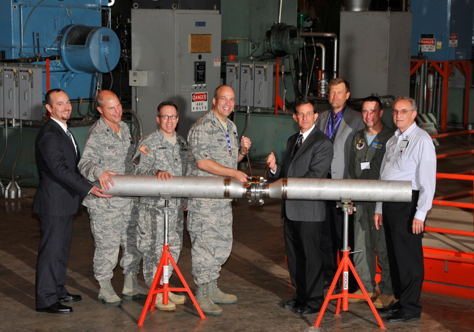 Kris Hughes, TEDAC program manager; Col. Rick Petito, AEDC Maintenance Division director; Col. Steven Roemhildt, U.S. Army Corps of Engineers, Mobile District commander; Col. Michael Brewer, AEDC commander; Michael Dorsch, Walbridge Aldinger project executive; Michael Schleider, AEDC Test Systems Division director; Cmdr. Brian Allen, AEDC Test Division deputy director; and Louis Vanacore, Aerospace Testing Alliance (ATA) director of Projects and Design Engineering at the TEDAC Phase II kickoff Sept. 20. (Photo by Rick Goodfriend)