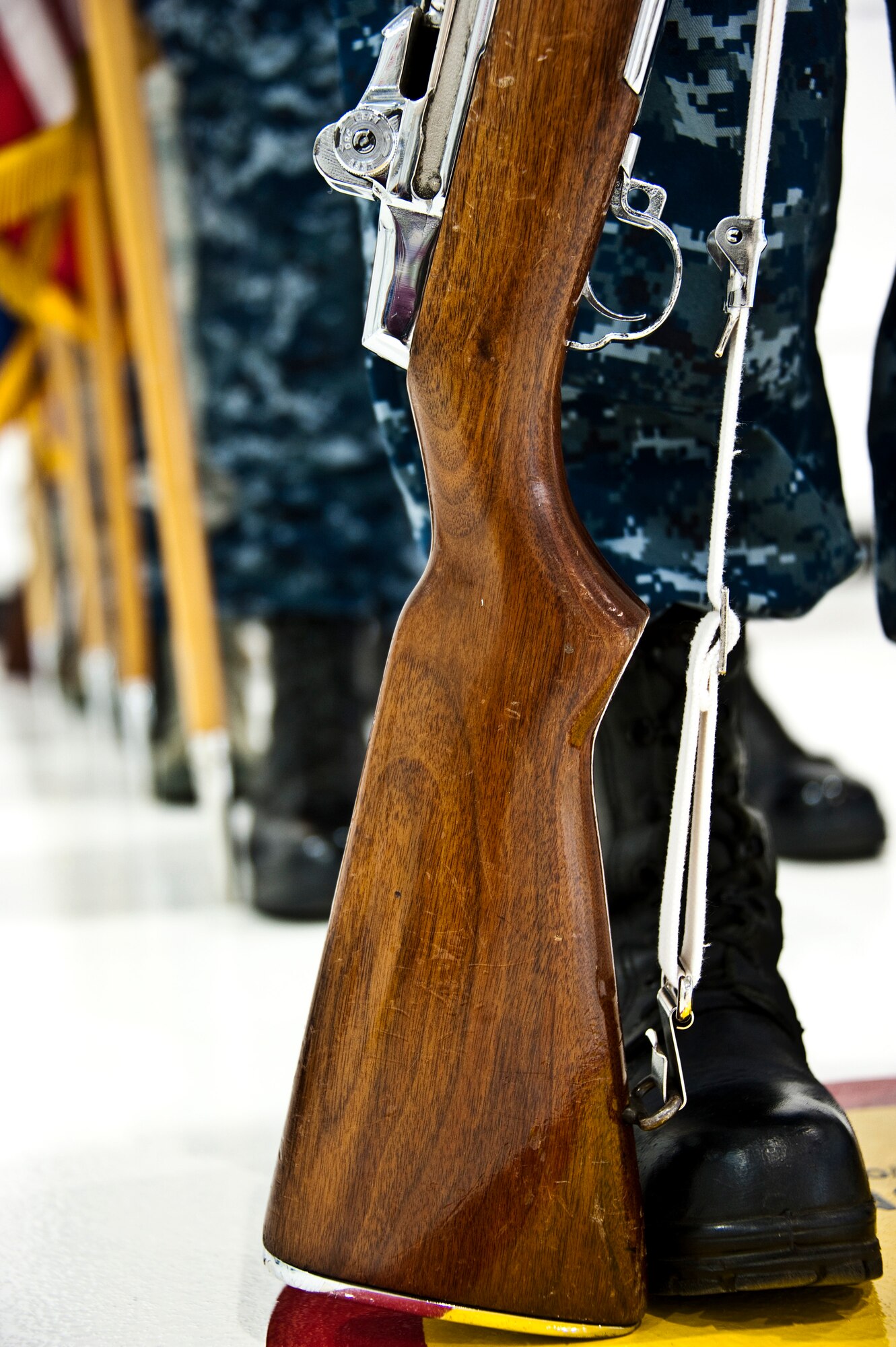 The newly-formed joint color guard team of 33rd Fighter Wing members waits to begin its first performance at a recent change of command ceremony at Eglin Air Force Base, Fla., Nov. 2. The joint color guard team members are:  Corpsman Sarah Lambert, Petty Officer 2nd Class James Peters, Senior Airman Chad Walker, Petty Officer 1st Class Jack Bauer, Master Sgt. Alexander Fortunato and Airman 1st Class Justin Glover.  (U.S. Air Force photo/Samuel King Jr.)