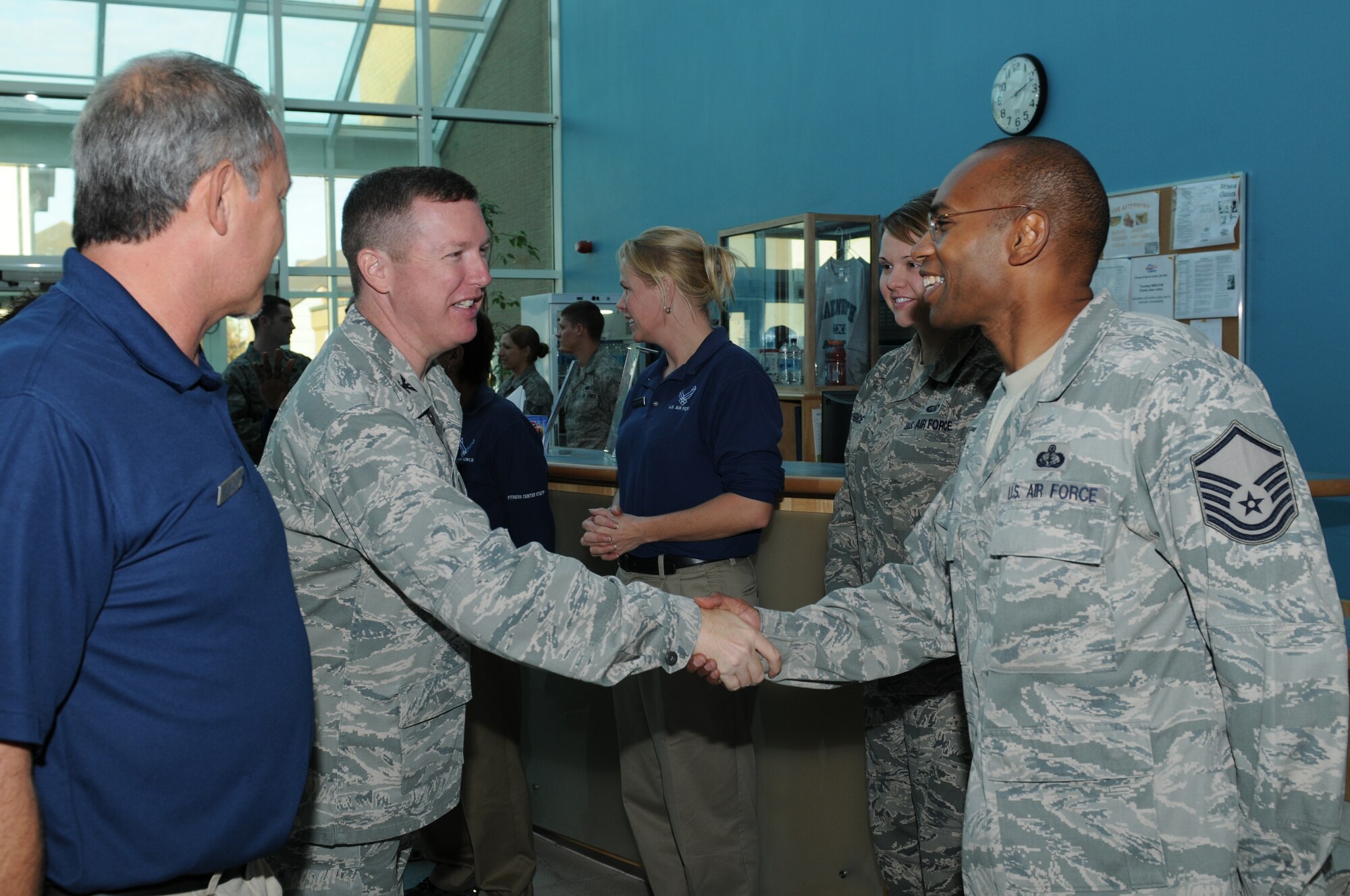 ROYAL AIR FORCE LAKENHEATH, England - Col. Christopher Sharpe, U.S. Air Forces in Europe director of manpower, personnel and services, greets Master Sgt. Collin Joseph, 48th Force Support Squadron fitness center NCO in charge, during a tour of the fitness center, Nov. 2, 2011. Sharpe visited the base to view the 48th Force Support Squadron facilities and personnel. (U.S. Air Force photo by Airman 1st Class Cory D. Payne)